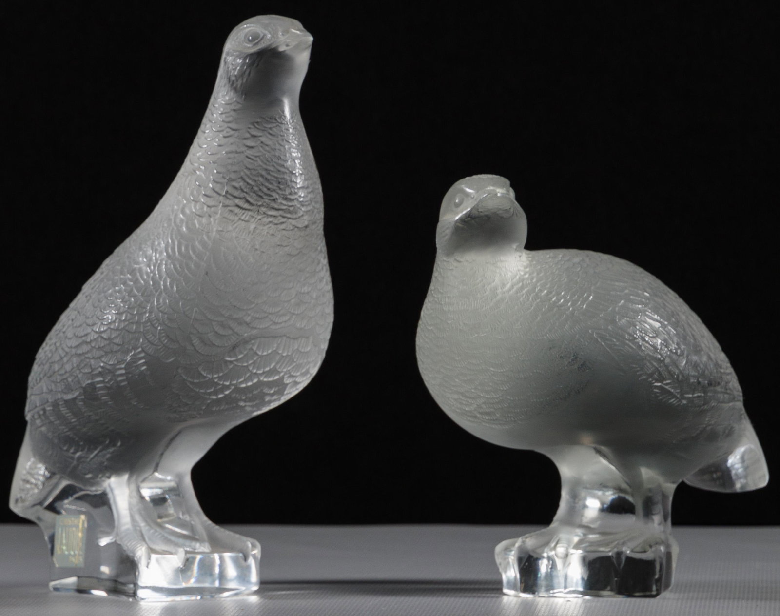 Lalique Crystal 'Perdix Debout' Bird Figurines: Lalique Crystal 'Perdix Debout' Bird Figurines A pair of partridges, frosted and clear glass, each etch signed on underside, taller bird retaining the original label Property from: a Long Grove, Illin