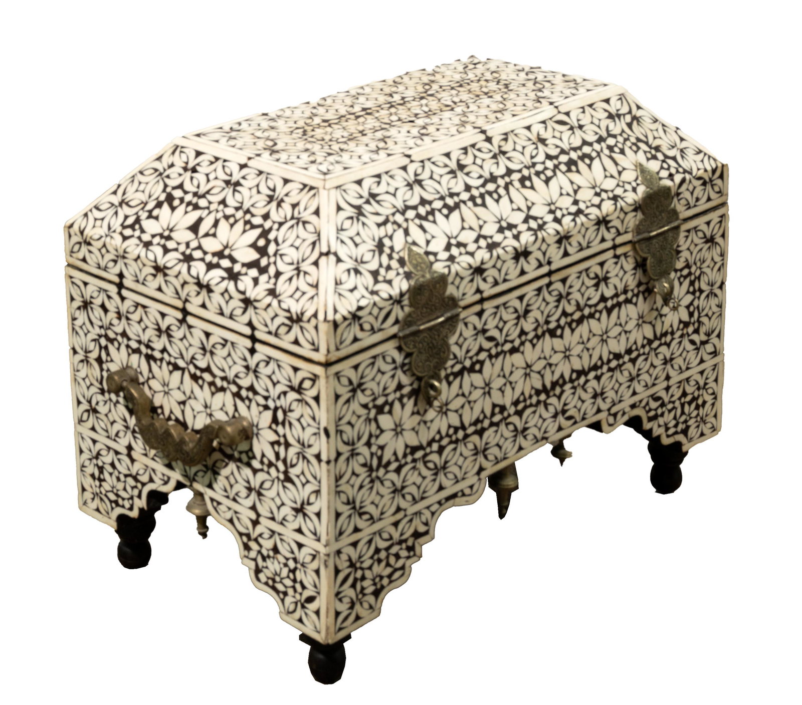 Moroccan Bone Inlay Trunk: Moroccan Bone Inlay Trunk Black and white bone inlaid domed box having an abstract design, brass handles on sides, silver-tone metal locks on front, (6) silver tone metal finials along bottom edges an