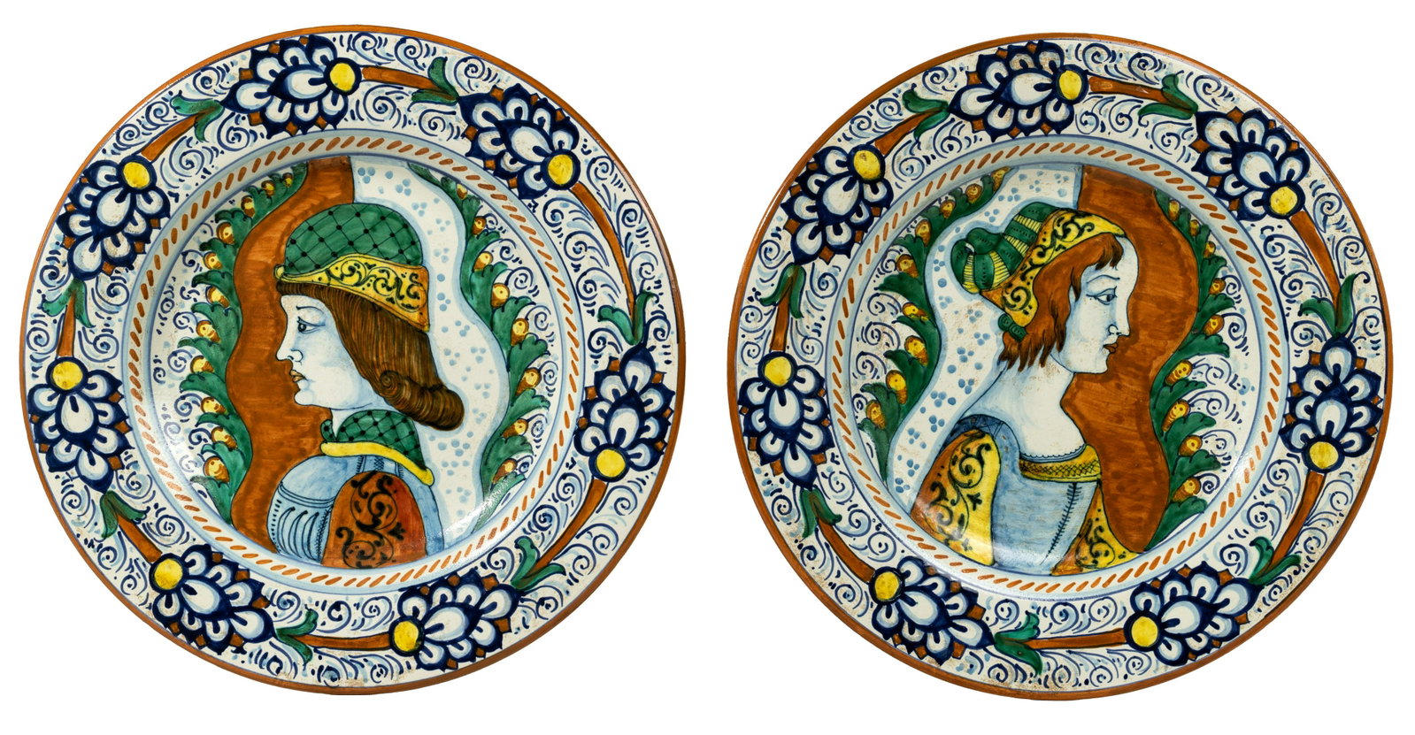 Italian Majolica Plates: Italian Majolica Plates (2) wall chargers having Renaissance style decoration, including a male profile and a female profile; both having hanging wires and labeled 'Forisportam / Maioliche D'arte Ogge