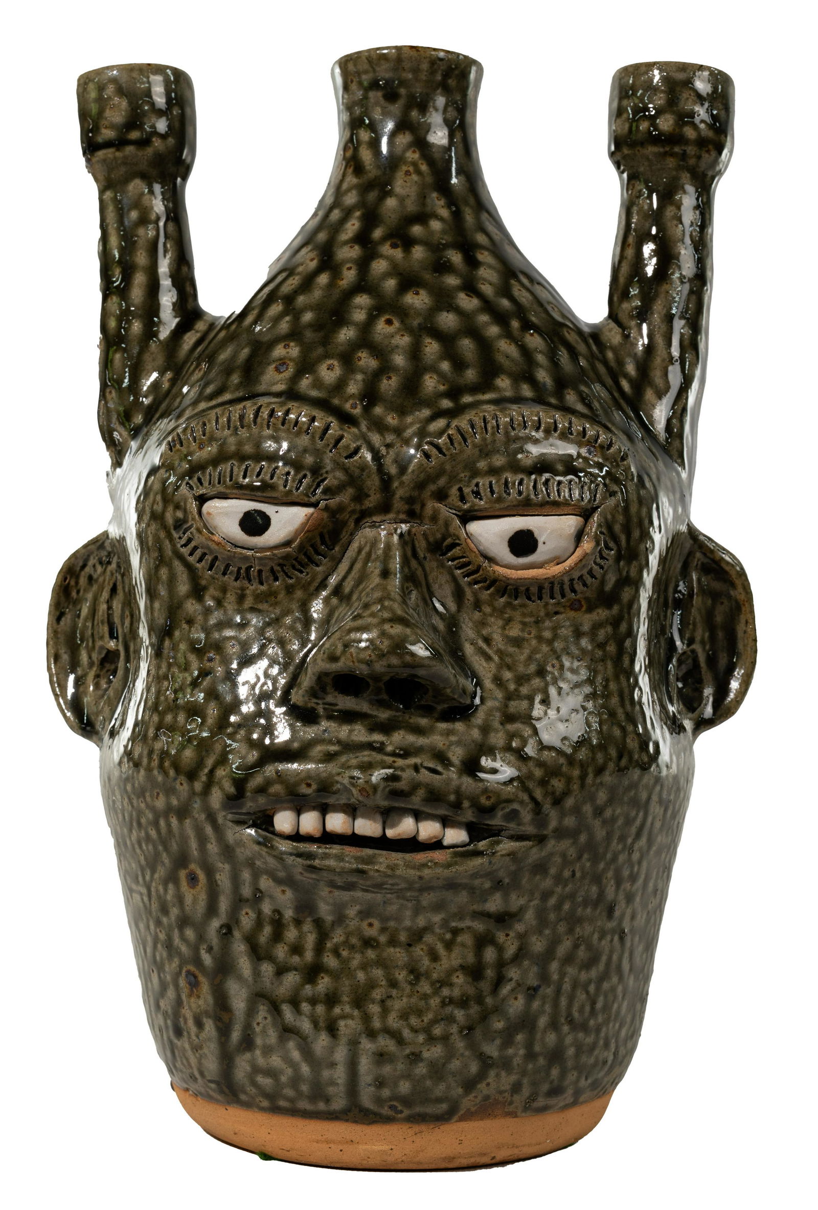 Alva Gusta (AG) Meaders (American, 1923-1994) Ugly Face: Alva Gusta (AG) Meaders (American, 1923-1994) Ugly Face Pottery Candelabra Alkaline-glazed, hand-modeled having (3) candle holes, inset eyes, applied ears and nose, incised eyebrows and eye lashes, op
