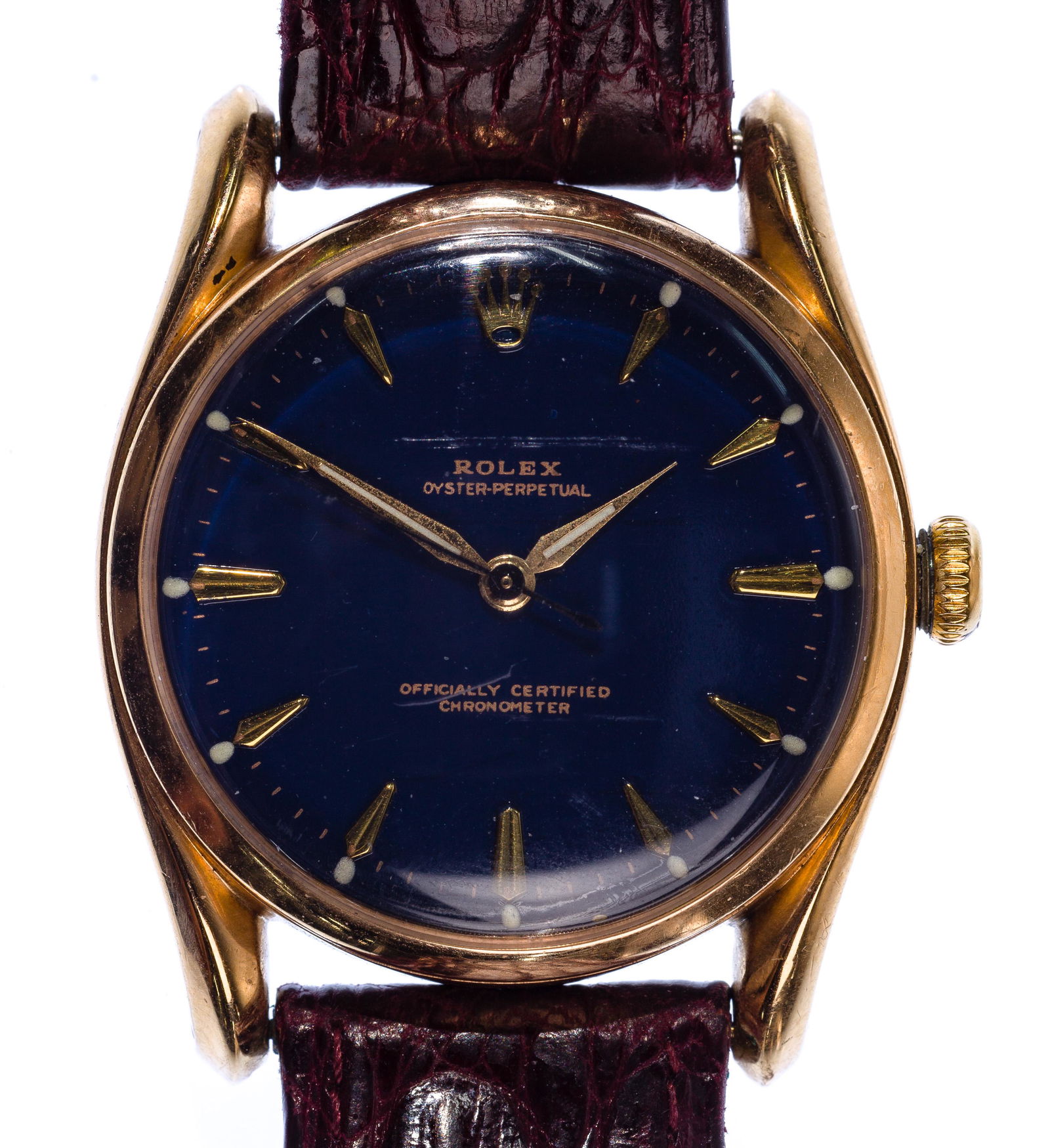 Rolex 18k Yellow Gold Case Oyster Perpetual Wrist Watch: Rolex 18k Yellow Gold Case Oyster Perpetual Wrist Watch Serial #670720 between lower lugs having a perpetual chronometer Swiss-made movement in a gold case on a leather band; marked '.750-18k' and '50