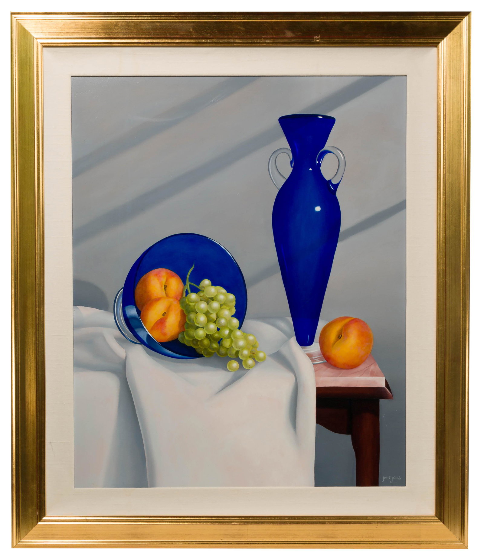 Jane Jones (American, b.1953) Oil on Panel: Jane Jones (American, b.1953) Oil on Panel Undated, signed lower right, depicting a still life composition of blue glass and fruit on a marble top table, in a gilt wood