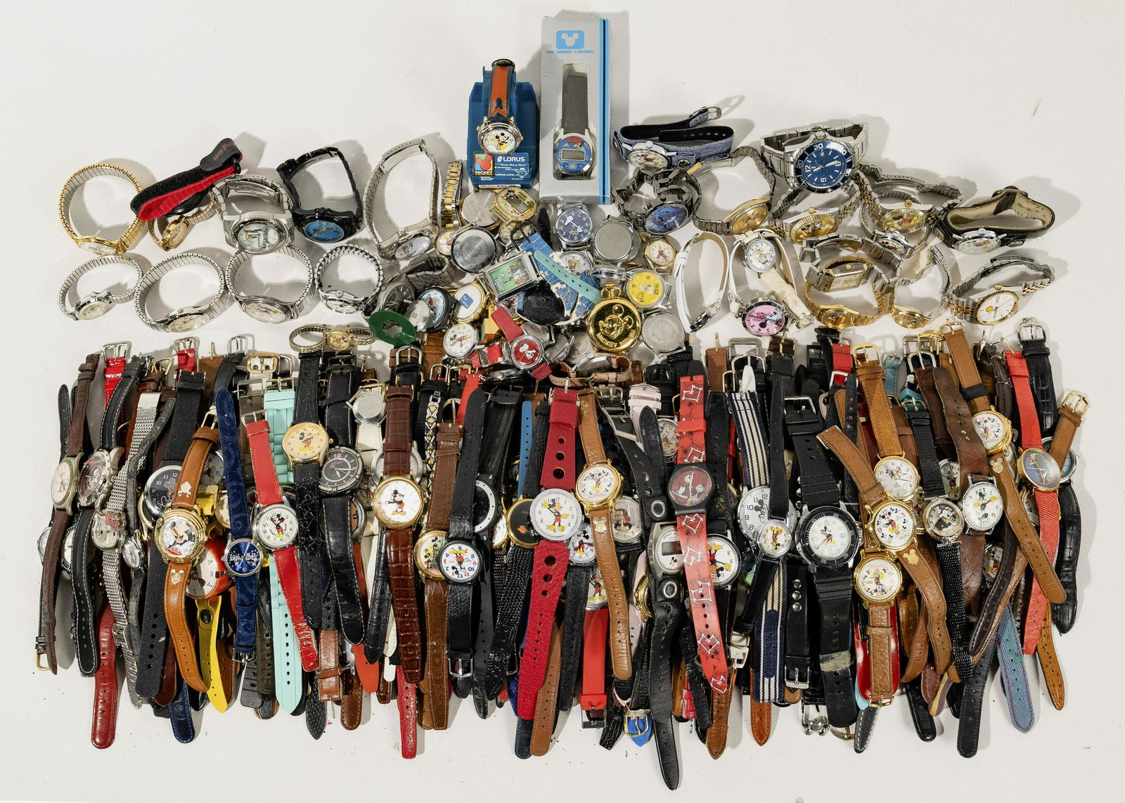 Character Wristwatch Assortment: Character Wristwatch Assortment (19) pounds including Disney, Peanuts, Hello Kitty, Garfield, Athletic Teams, Advertising, Video Games; in various colors, sizes and ban