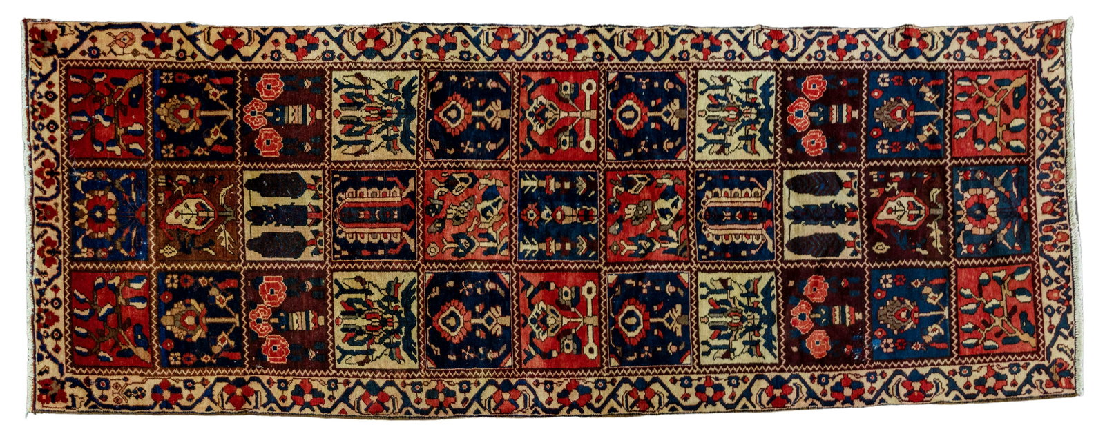 Persian Bakhtiari Wool Runner: Persian Bakhtiari Wool Runner Handwoven having individual squares showing a garden motif in hues of blue, red, rust and cranberry on a field of cream; with fringe