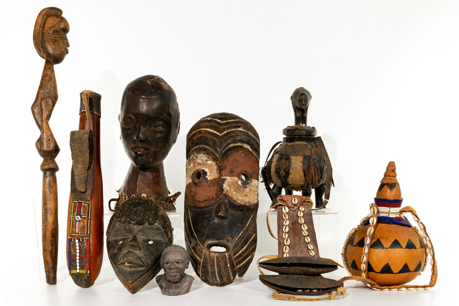 African Ethnographic Object Assortment: African Ethnographic Object Assortment (9) 20th century items including an Ekoi skin-covered wood and basketry headdress crest from Nigeria, a Dan mask from Liberia, a
