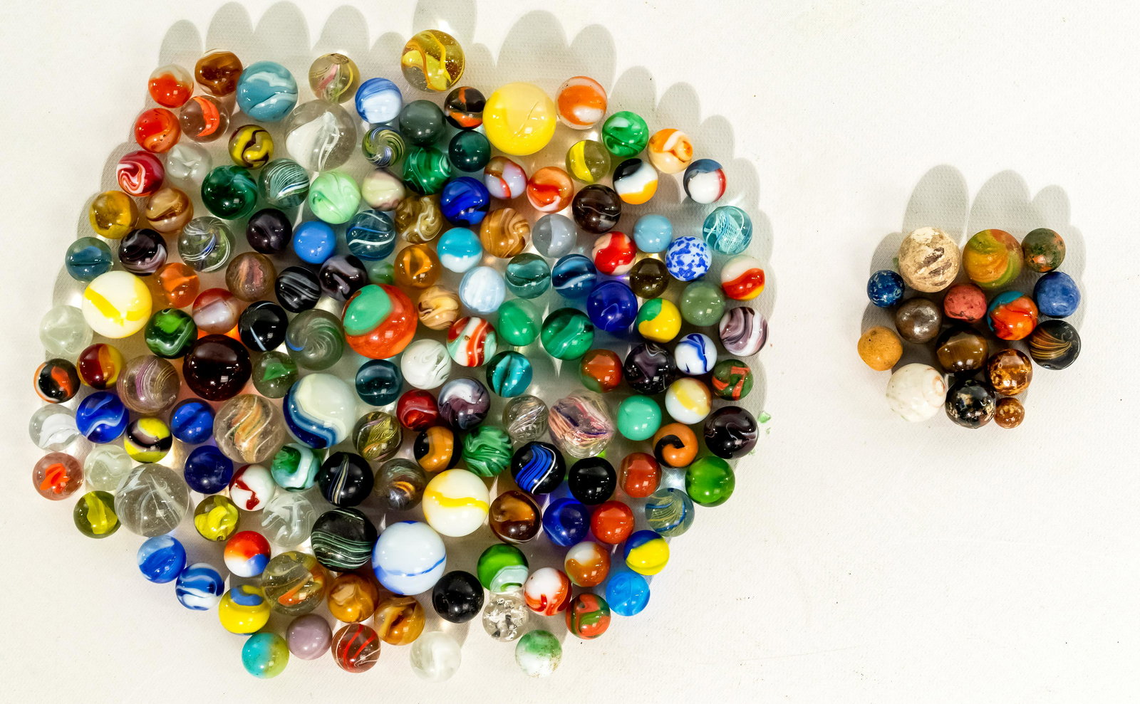 Marble Assortment: Marble Assortment Approximately (160) marbles including a banded lutz, onion skin, Litticinio yellow core, Indian swirl, crockery, ribbon core, end of days cloud, singl