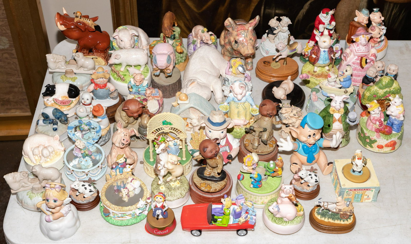Pig Assortment: Pig Assortment Including music boxes, cups, glassware, still banks, papier mache sculptures, lamps, candle holders, games and toys Property from: a Chicago, Il