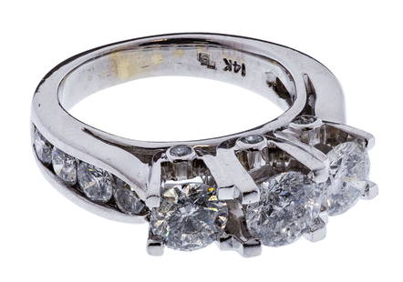 14k White Gold and Diamond Ring: 14k White Gold and Diamond Ring Having (3) round cut diamonds with the center diamond weighing approximately 0.65 carats (5.5mm by 3.6mm), I3 clarity, F/G color; side diamonds each weighing