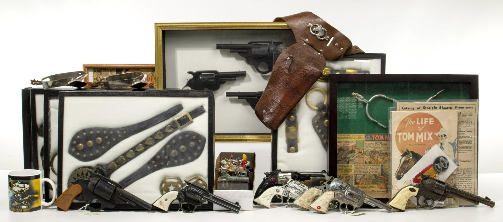 Western Themed Toy and Accessory Assortment: Western Themed Toy and Accessory Assortment Over (17) items including (7) shadow box and Riker frame displays of multiple objects, including (4) frames of decorative metal and leather horse tack; (6) 