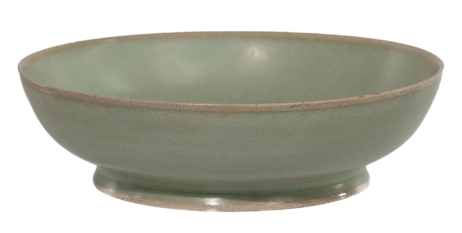 Chinese Celadon Glazed Porcelain Bowl: Chinese Celadon Glazed Porcelain Bowl Thinly potted on an everted foot ring and fully glazed in green having hints of blue in the recesses and a warm blush at the high points of rim and foot, (3) kiln