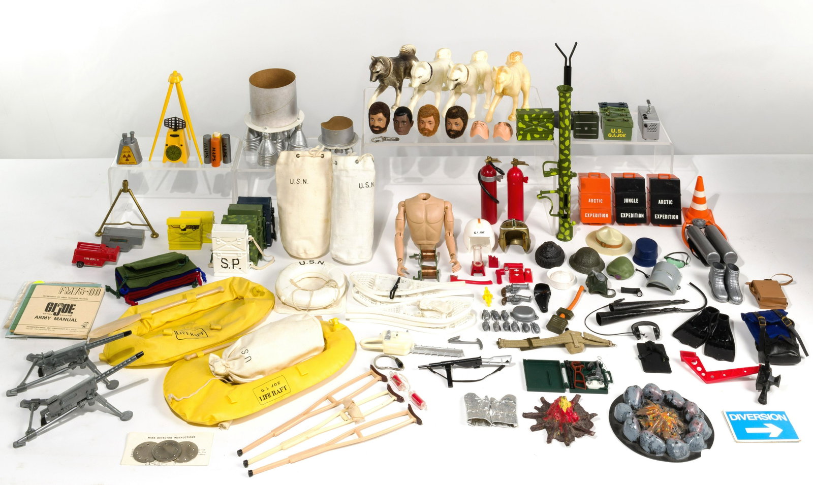 GI Joe Accessory and Clothing Assortment: GI Joe Accessory and Clothing Assortment Over (500) pieces with examples of ammunition belts, helmets, weapons, foot gear, life vests, ammunition boxes and uniforms; the accessories from the 1960's to