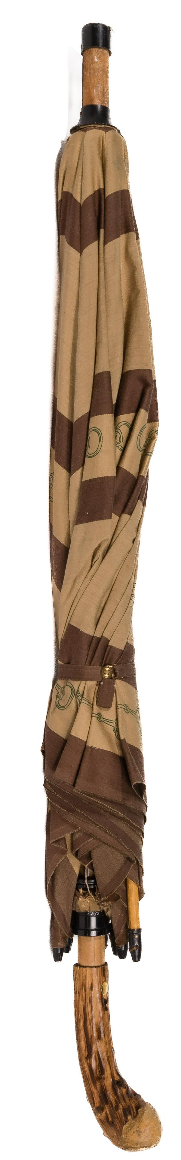Gucci Designer Umbrella: Gucci Designer Umbrella Having a burl wood handle Length: 37 inches Condition: Good to Fair, light tattering to the edges and some seams; wear to the plastic cap covering the tip of the parasol; (2) r