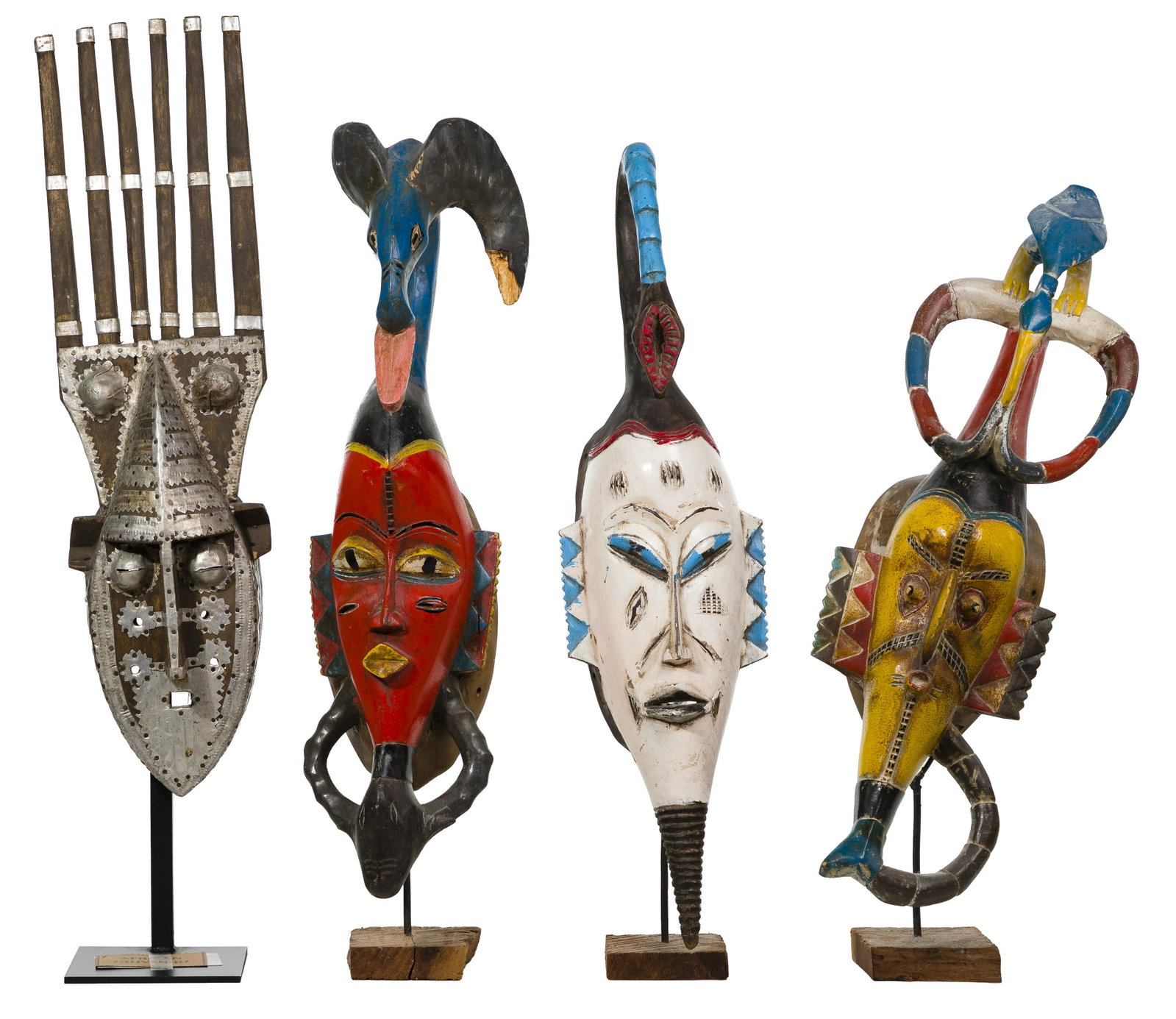 African Carved Mask Assortment: African Carved Mask Assortment (4) souvenir masks including (3) in the style of the Senufo tribe and a Marka style; all having metal stands Property from: a Deerfield, Illinois collector Length: 26 1/