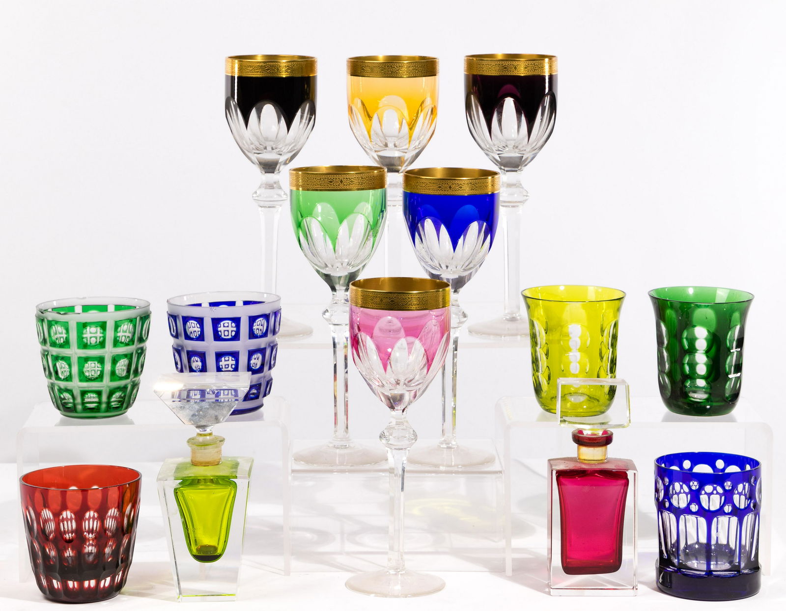 Art Glass Cut-to-Clear Assortment: Art Glass Cut-to-Clear Assortment (14) items including a pair (2) Christofle 'Kawaii' water glasses in dark and light green; (6) multi-colored wine glasses having gold overlay rims; (4) old fashion tu