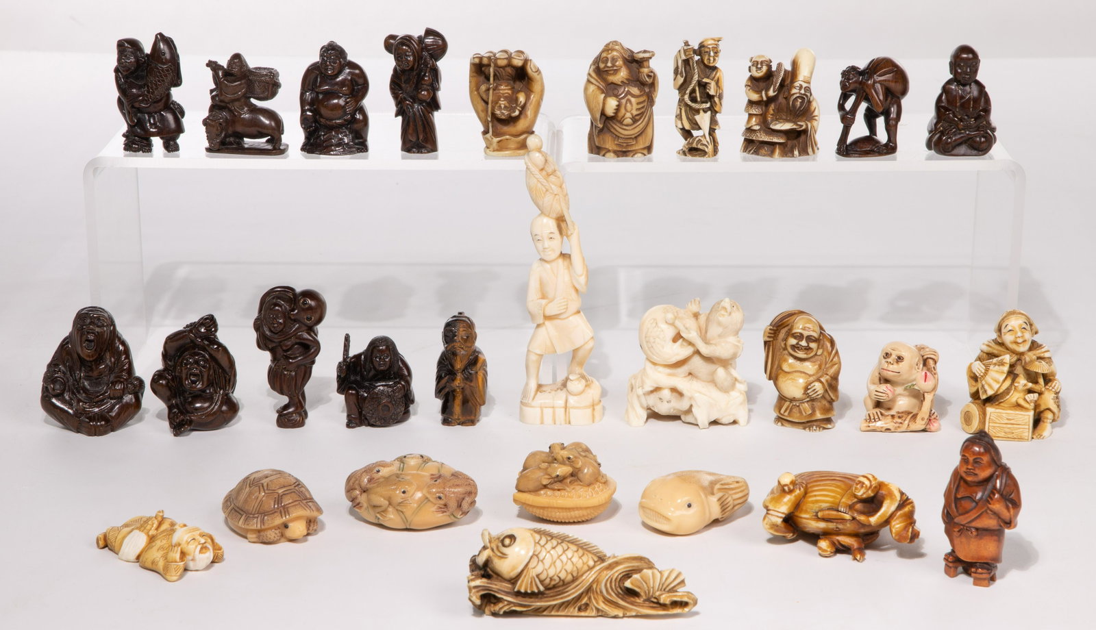Asian Netsuke and Okimono Figurine Assortment: Asian Netsuke and Okimono Figurine Assortment (28) items including (21) Netsuke style and (7) Okimono style, having various forms with materials including bone, wood, tagua nut and tiger eye; most sig