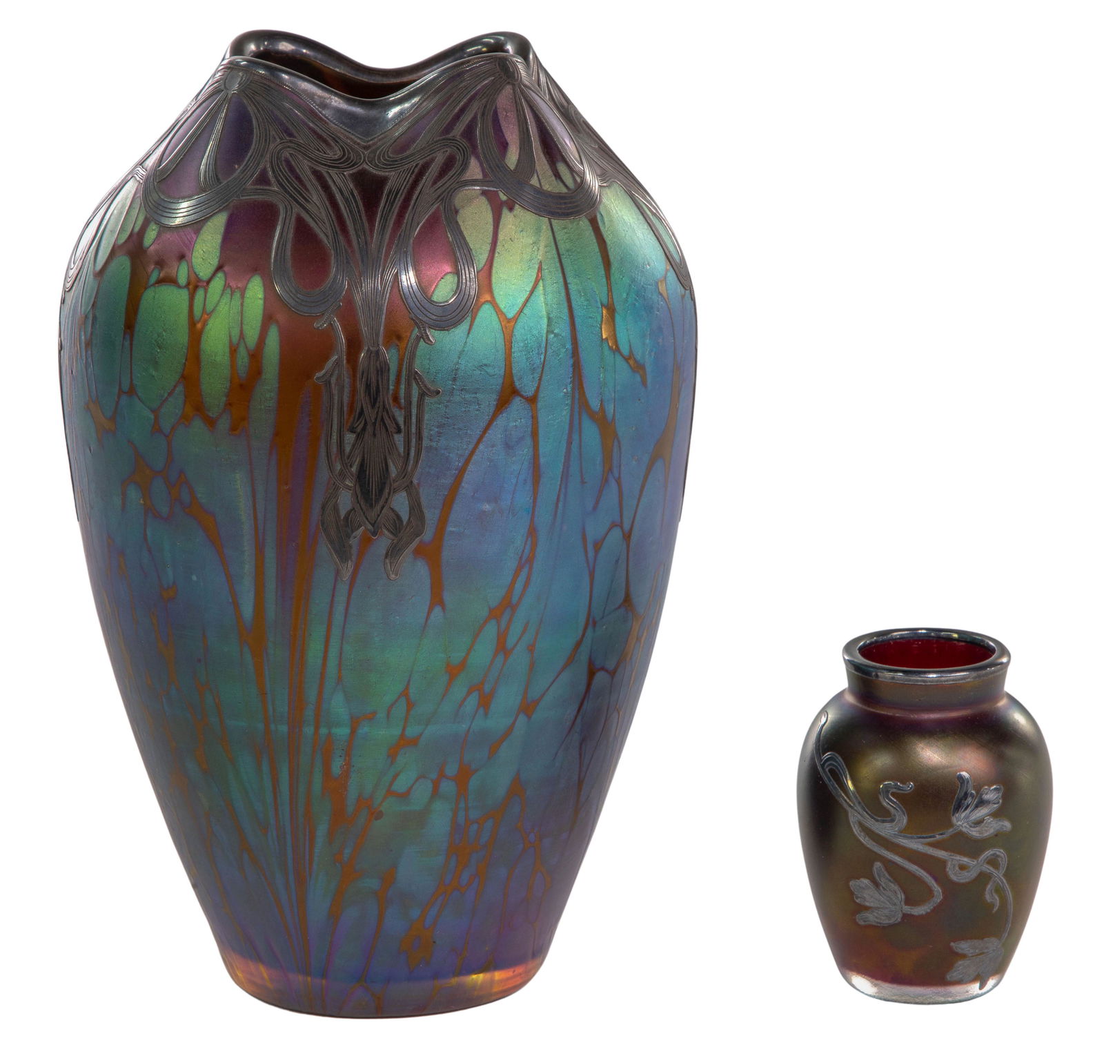 (Attributed to) Loetz Silver Overlay Vases: (Attributed to) Loetz Silver Overlay Vases (2) items including Art Deco style overlay having a ruffle neck, iridescent and blue over an amber color glass; and a smaller floral overlay having an irides