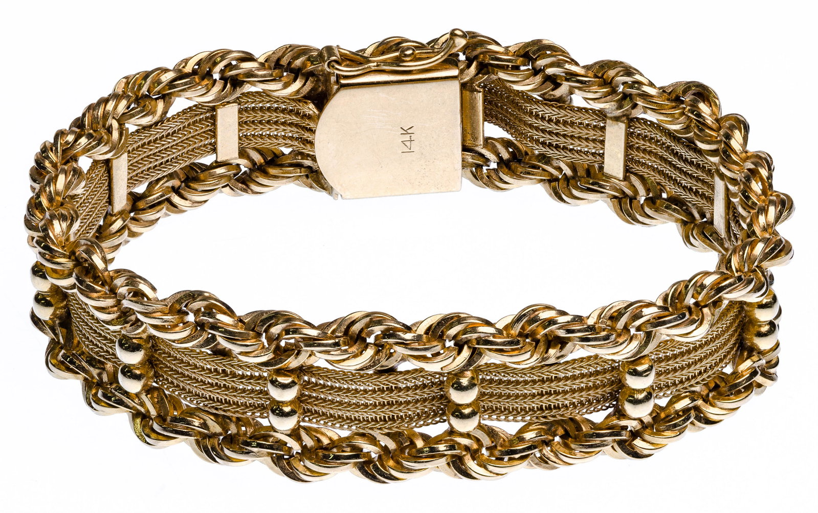 14k Yellow Gold Bracelet: 14k Yellow Gold Bracelet Woven design having a mesh center flanked by twisted rope chain on each side and topped with small gold balls, marked '14k' on clap Property from: a Park Ridge, Illinois estat