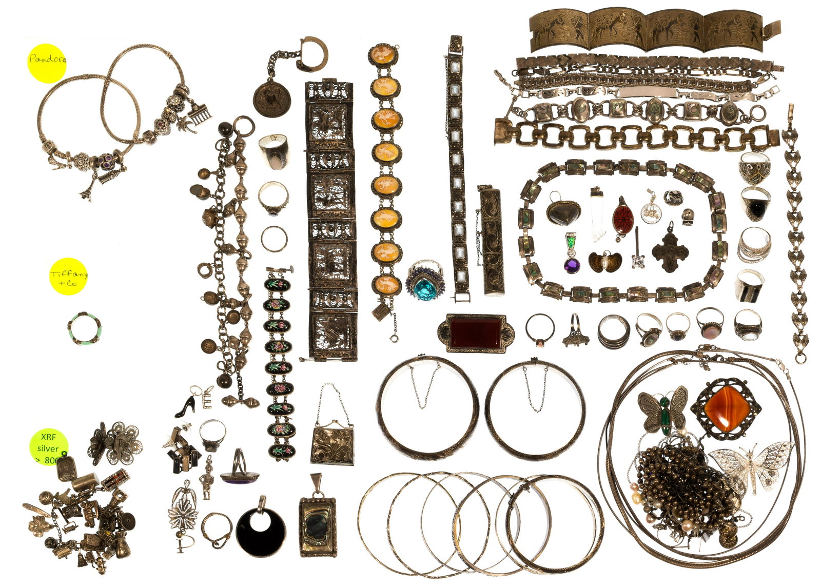 Silver Jewelry Assortment: Silver Jewelry Assortment Including a 'Tiffany & Co' blue enamel X band ring and (2) 'Pandora' charm bracelets a having (11) 'Pandora' charms, all marked '925'; together with approximately (2) pounds 