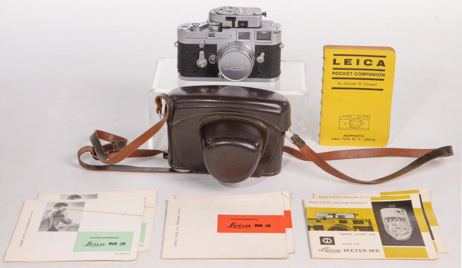 Leica M3 35mm Camera and Lens with Meter: Leica M3 35mm Camera and Lens with Meter Serial #M3-1090 136, manufactured in Germany, having an Leitz Wetzlar 1:2.8/50 serial #1910645 Elmar lens, Leica-Meter MR serial #20192, leather case and manua
