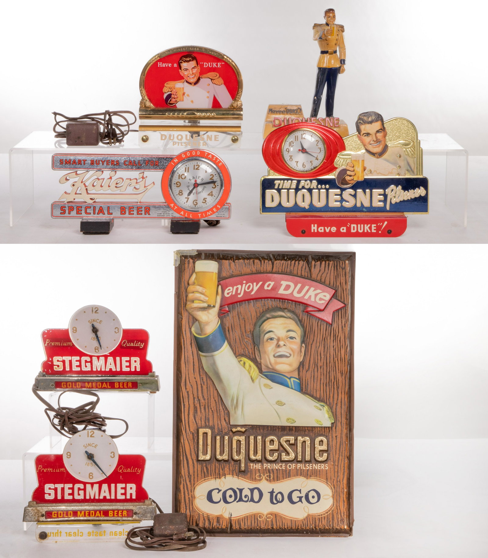 Beer Advertising Sign Assortment: Beer Advertising Sign Assortment (7) items including (2) Tel-a-sign Inc. Stegmaier illuminated clock cash register signs, with a sign retaining mounting fixture and each retaining manufacturer label; 