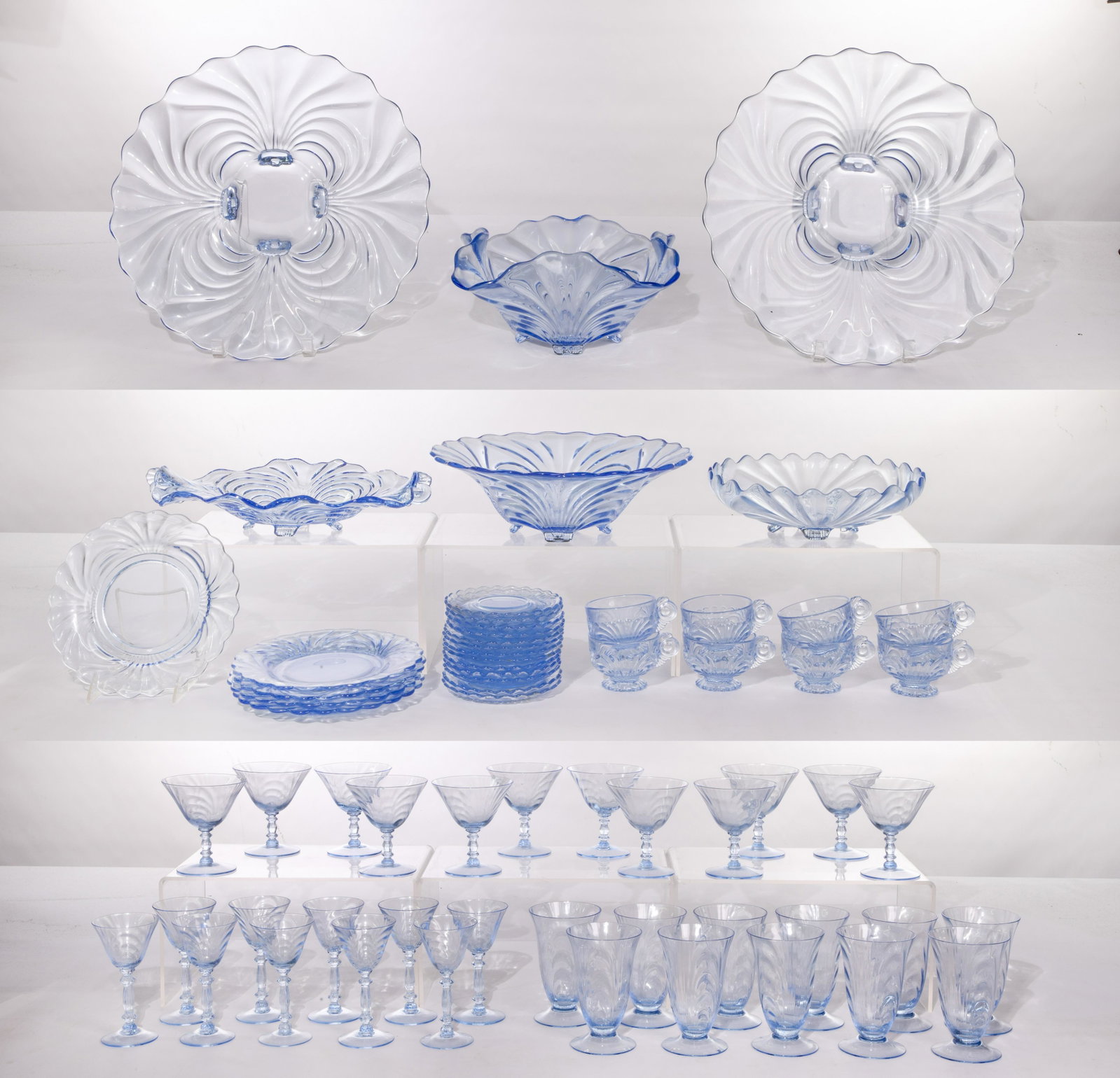 Cambridge 'Caprice Blue' Glass Dishware Assortment: Cambridge 'Caprice Blue' Glass Dishware Assortment Approximately (75) items including plates, cups, saucers, serving platters, bowls, wine glasses and goblets Property from: a Lombard, Illinois collec