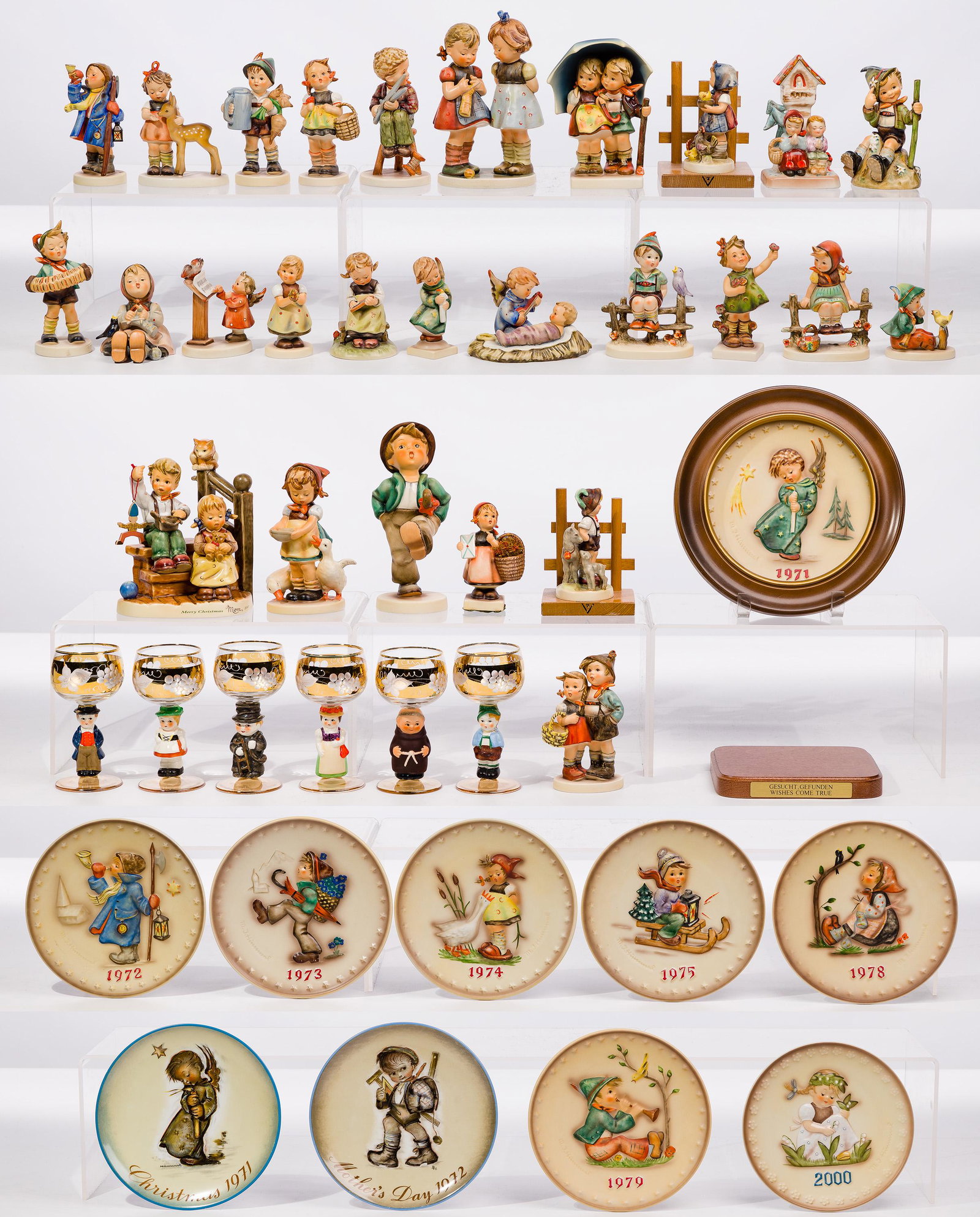 Hummel Figurine and Collector Plate Assortment: Hummel Figurine and Collector Plate Assortment (39) items including (28) figurines in various sizes including #257, #186, #94 and #109, (10) collector plates, mostly Christmas, and a set of (6) 'Dolly