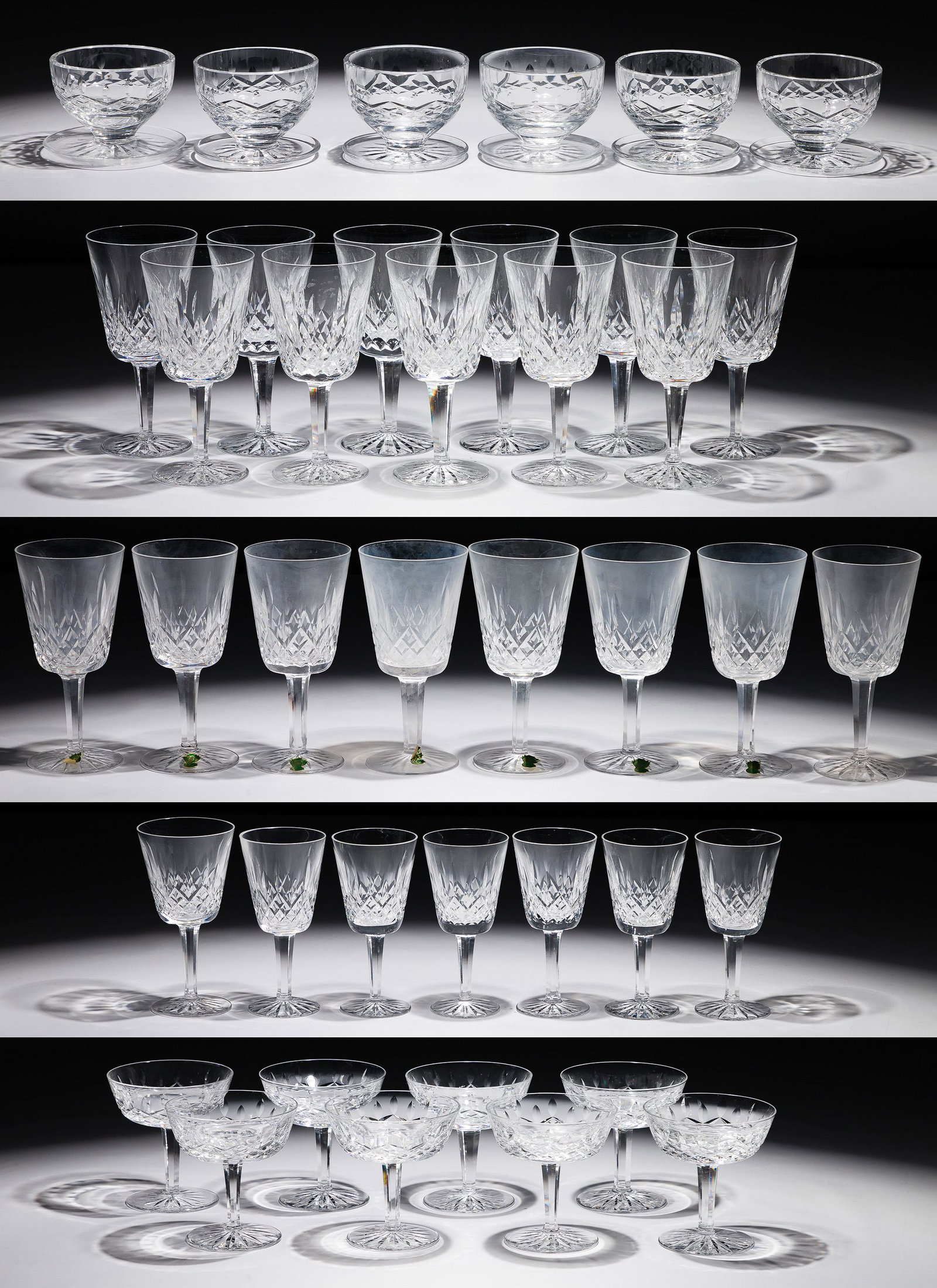 Waterford Crystal 'Lismore' Stemware Collection: Waterford Crystal 'Lismore' Stemware Collection (40) items including (7) white wine, (8) champagne / tall sherbet, (6) footed dessert, (17) water goblets and a white wine, all having acid etched mark 