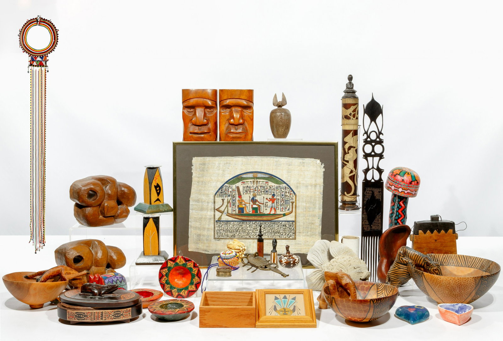 Ethnographic Object Assortment: Ethnographic Object Assortment (26) items including, from Africa including a Maasai beaded choker necklace having beaded pendant strands, beaded purse having lid that slides on beaded strap, (2) carve