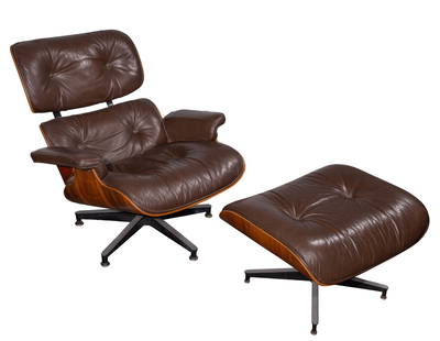 Charles and Ray Eames Lounge Chair and Ottoman: Charles and Ray Eames Lounge Chair and Ottoman For Herman Miller, having molded plywood shells, brown leather cushions, cast aluminum base that pivots and matching ottoman, retaining original labels t