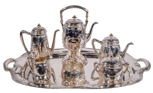 Gorham 'Martele' Sterling Silver Beverage Service: Gorham 'Martele' Sterling Silver Beverage Service (7) piece Art Nouveau floral style, hand-hammered beverage set having a two-handle tray, a tilting hot water kettle and burner, a coffee pot, a tea po