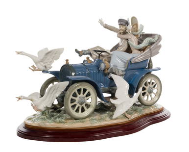 Lladro #1375 'Car in Trouble' Porcelain Figurine: Lladro #1375 'Car in Trouble' Porcelain Figurine Numbered 1094 of only 1500 pieces, having mahogany stained base, signed on edge, includes certificate of authenticity from Lladro Property from: an Est