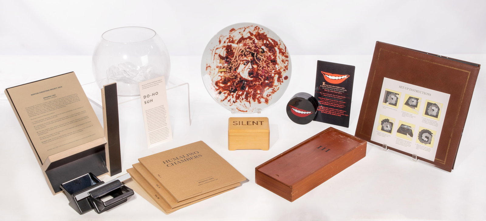 Peter Norton Family Christmas Project Gift Assortment: Peter Norton Family Christmas Project Gift Assortment (7) items including Christian Marclay Silent / Listen music box, a Do-Ho Soh glass bowl, a Peter Coffin pop-up picture book, a Lorna Simpson wish