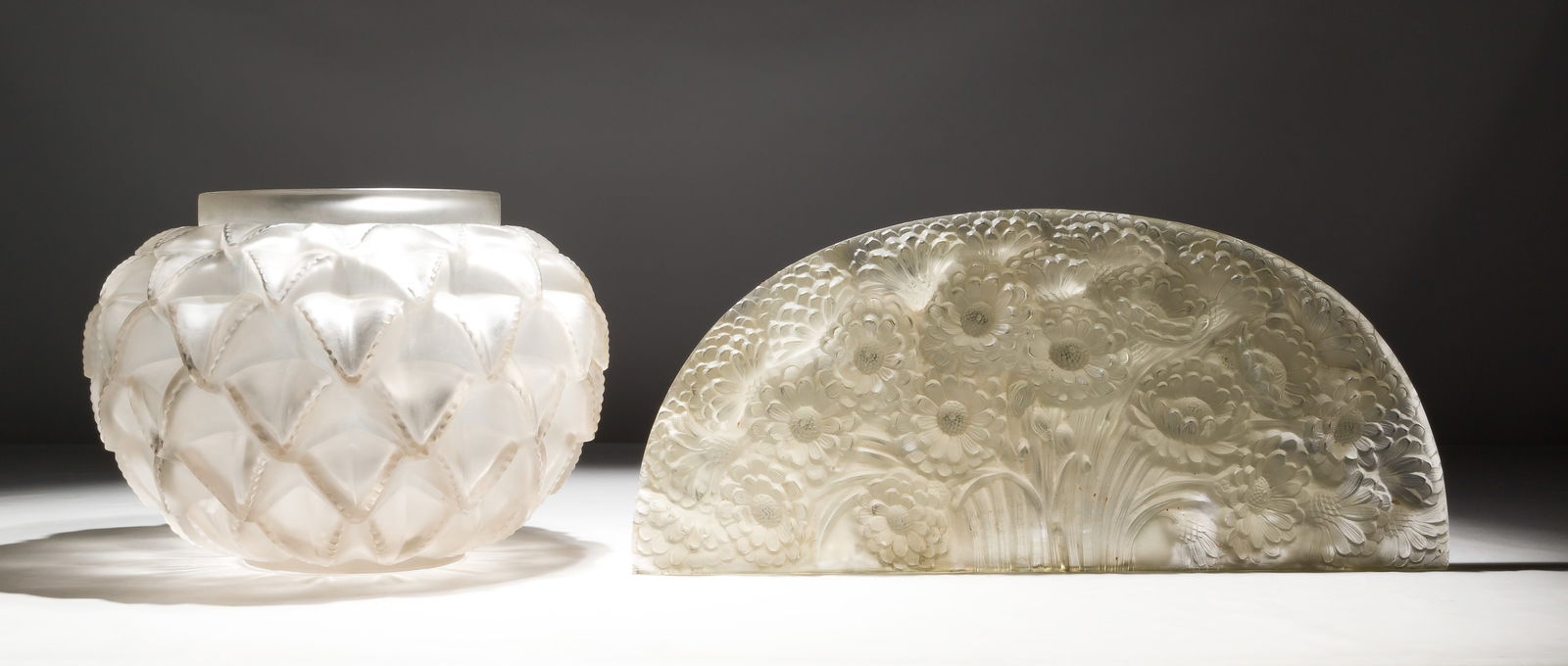 Lalique Style Decorative Objects: Lalique Style Decorative Objects (2) items including a vase having frosted cactus leaf design and an arched frosted glass mirror top having a marigold motif, both items having spurious signatures, vas