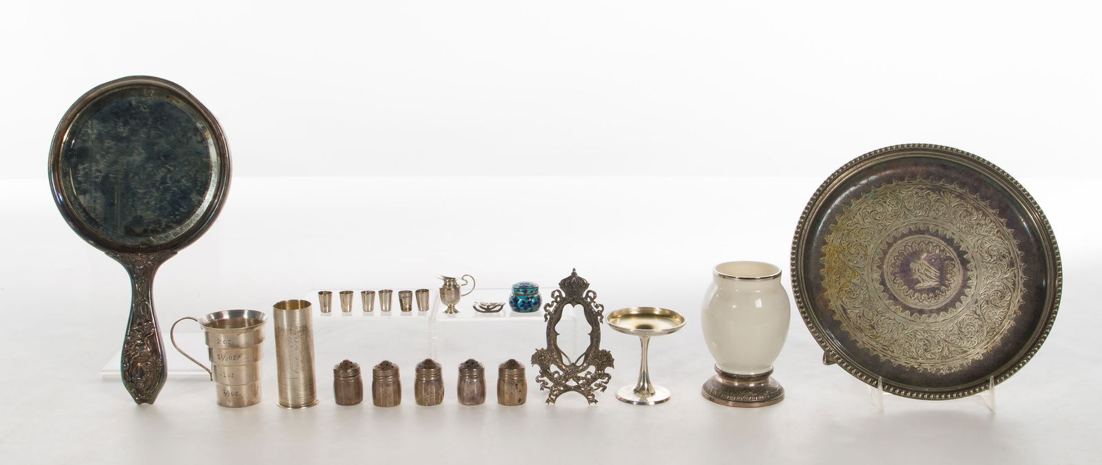 Sterling Silver Assortment: Sterling Silver Assortment (12) total items including (2) jiggers, a miniature pitcher and glass set, (5) salt and pepper shakers, a miniature compote, a vase, a frame and a pill box (most marked 'ste
