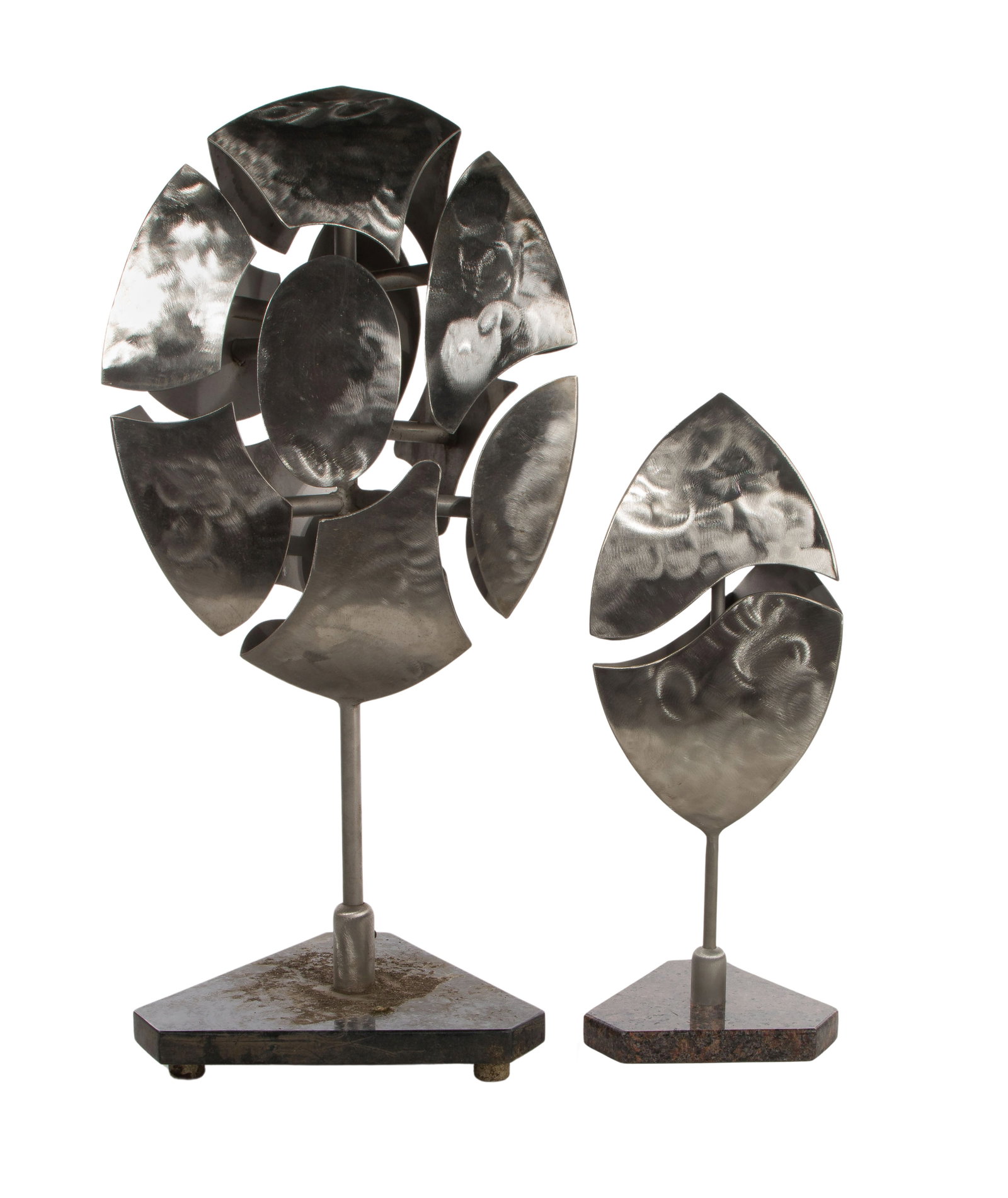 Kenneth Nelson (American, 1932-2022) Metal Sculptures: Kenneth Nelson (American, 1932-2022) Metal Sculptures (2) items including a 2007, unsigned, swirl patterned steel abstract segmented prolate spheroid having a granite base and a 2017 unsigned, swirl p
