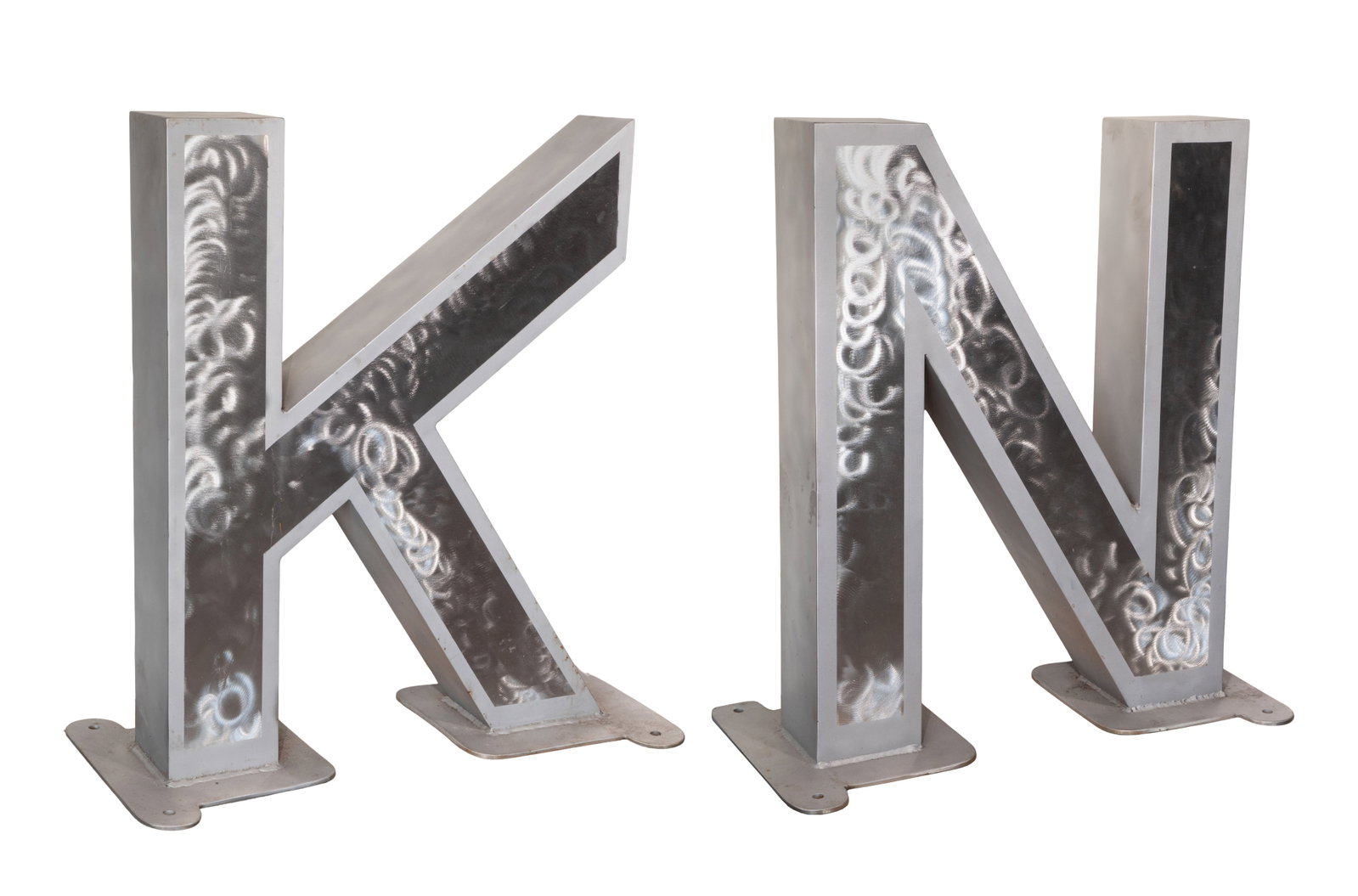 Kenneth Nelson (American, 1932-2022) Steel Letter Sculptures: Kenneth Nelson (American, 1932-2022) Steel Letter Sculptures (2) items of welded steel having an etched finish leaving the front brushed surfaces in reserve within etched margins, comprising the artis