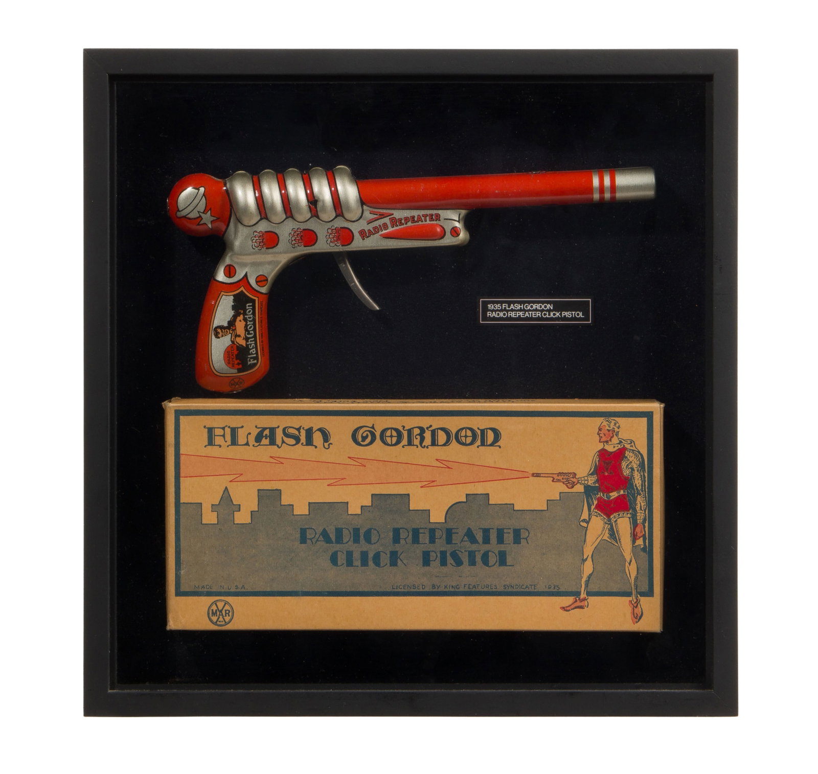 Louis Marx Flash Gordon Click Pistol and Box: Louis Marx Flash Gordon Click Pistol and Box 1935 radio repeater toy gun, box and toy gun having maker mark, displayed in shadow box frame Property from: an Estate, Chicago (Norwood Park East), Illino