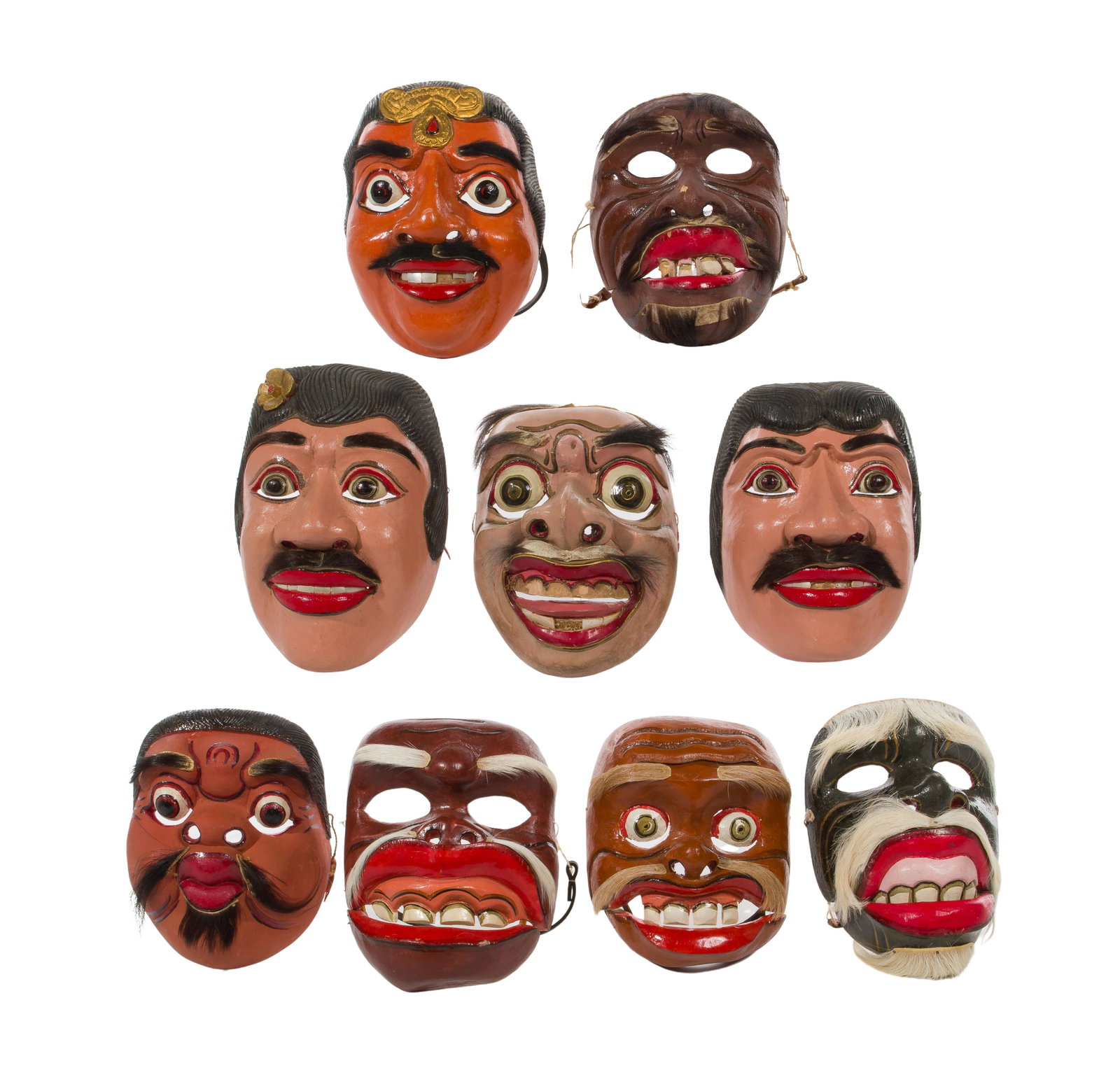 Balinese Mask Assortment: Balinese Mask Assortment (9) hand painted items including some having articulated jaws, animal hair, shell teeth, ear ornaments, purchased c.1960 Property from: an Estate, Elgin, Illinois Height: 9 in