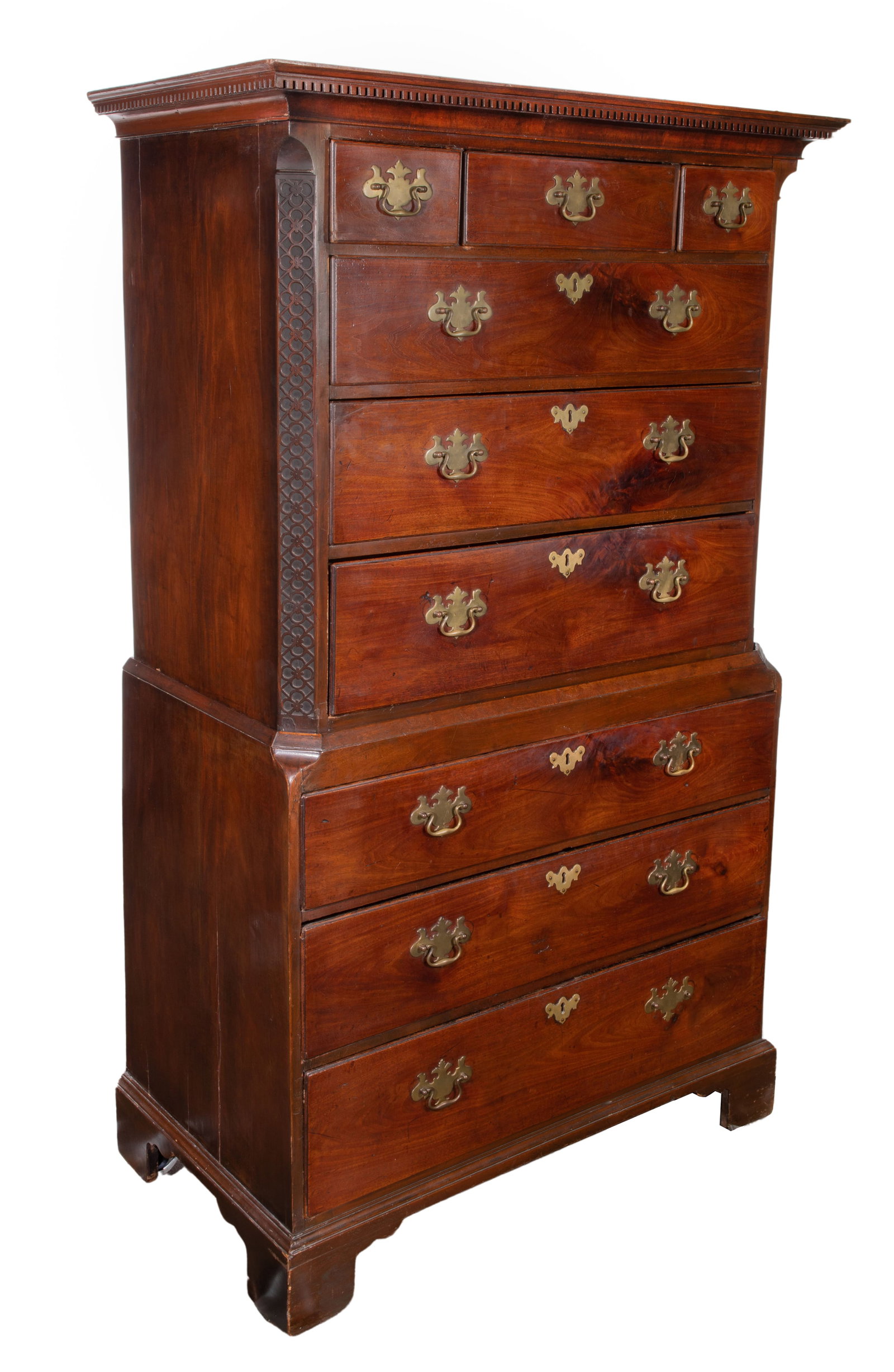 English Mahogany Chest on Chest: English Mahogany Chest on Chest Upper case having a cornice top, dentil molding, carved corner panels, three partial drawers over three full drawers, lower case having three full drawers, rising on br