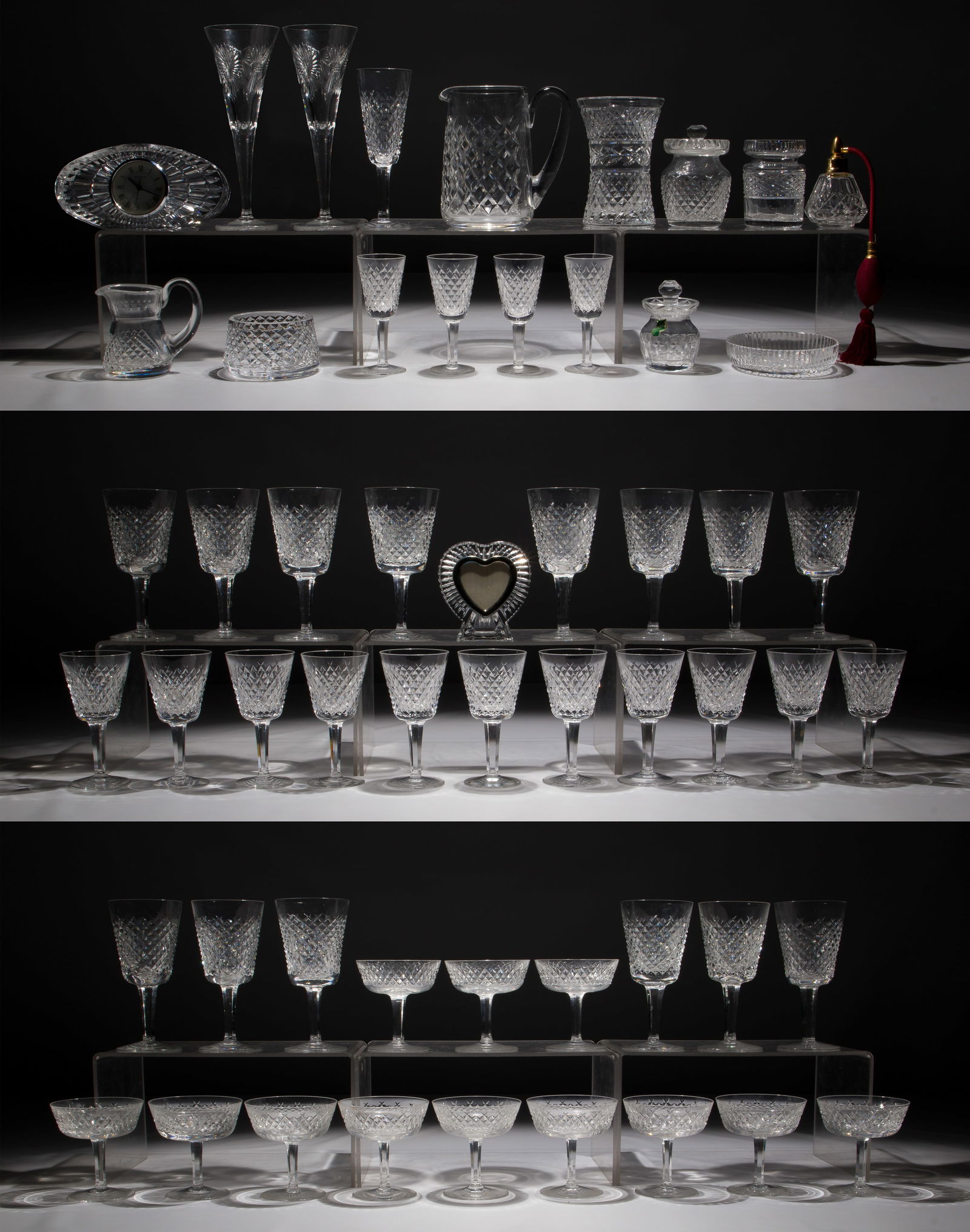 Waterford Crystal Assortment: Waterford Crystal Assortment (55) items including (14) water goblets, (11) wine, (12) champagne coupes, (4) cordials and a flute, all in the Alana pattern, (2) millennial toasting glasses as well as v