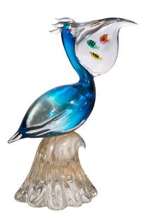 Elio Raffaeli for Oggetti Murano Glass Pelican: Elio Raffaeli for Oggetti Murano Glass Pelican Undated, signed on underside, depicting a pelican and three fish in his beak while sitting atop of a wave, using the Sommerso technique Property from: an