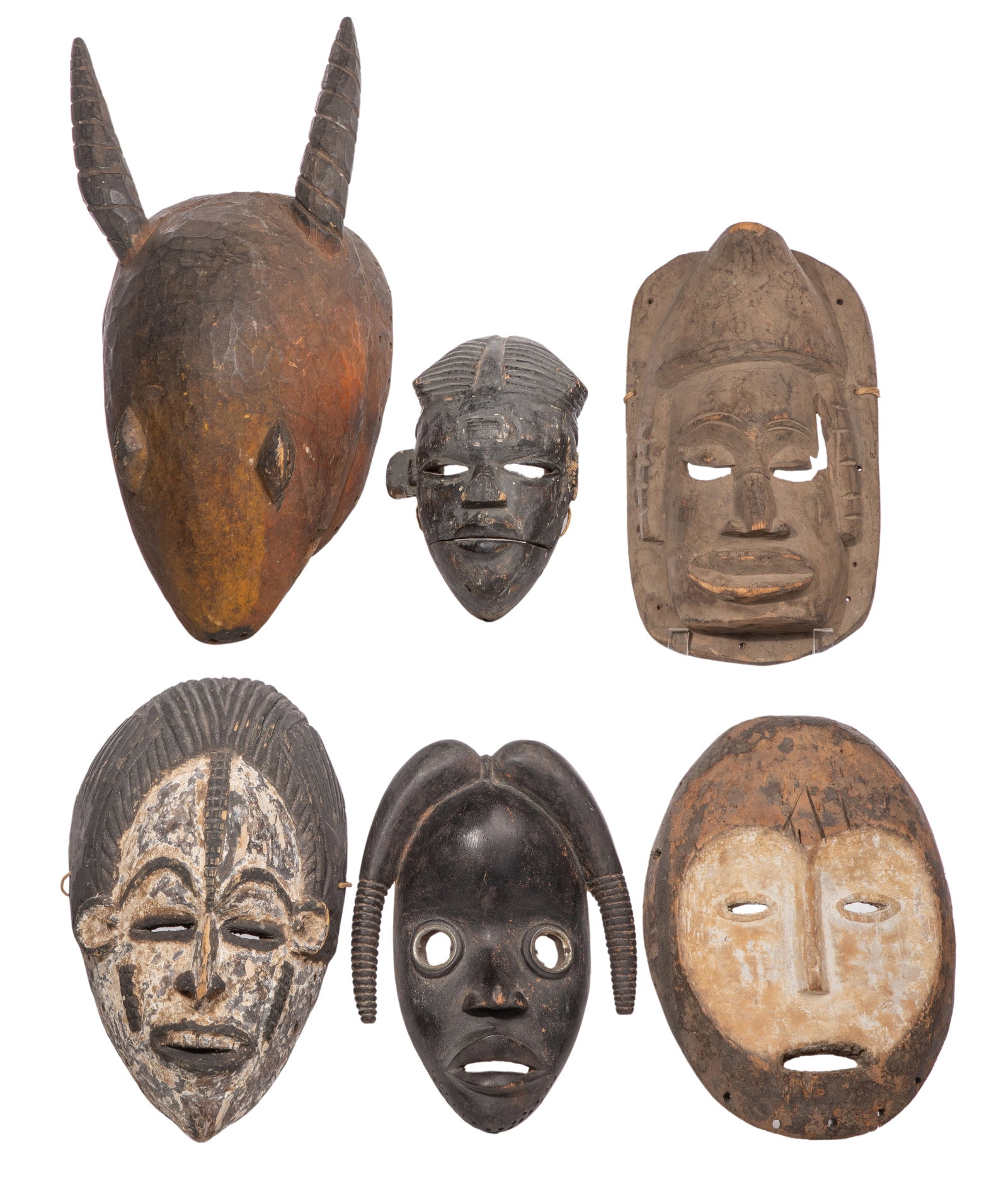 African Carved Wood Mask Assortment: African Carved Wood Mask Assortment (6) items including a Lega, an Ivory Coast, a hinged wood mouth, a black and white painted, an animal form and a carved dark wood Property from: an Estate, Chicago 