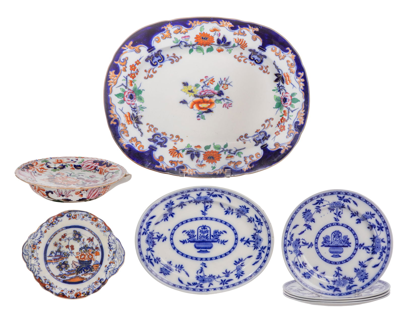 Minton and Delft Pottery Assortment: Minton and Delft Pottery Assortment (8) items including a c.1839 platter and a plate, (4) blue and white plates and a platter, all marked Minton and Delft as well as an ironware heating plate Property