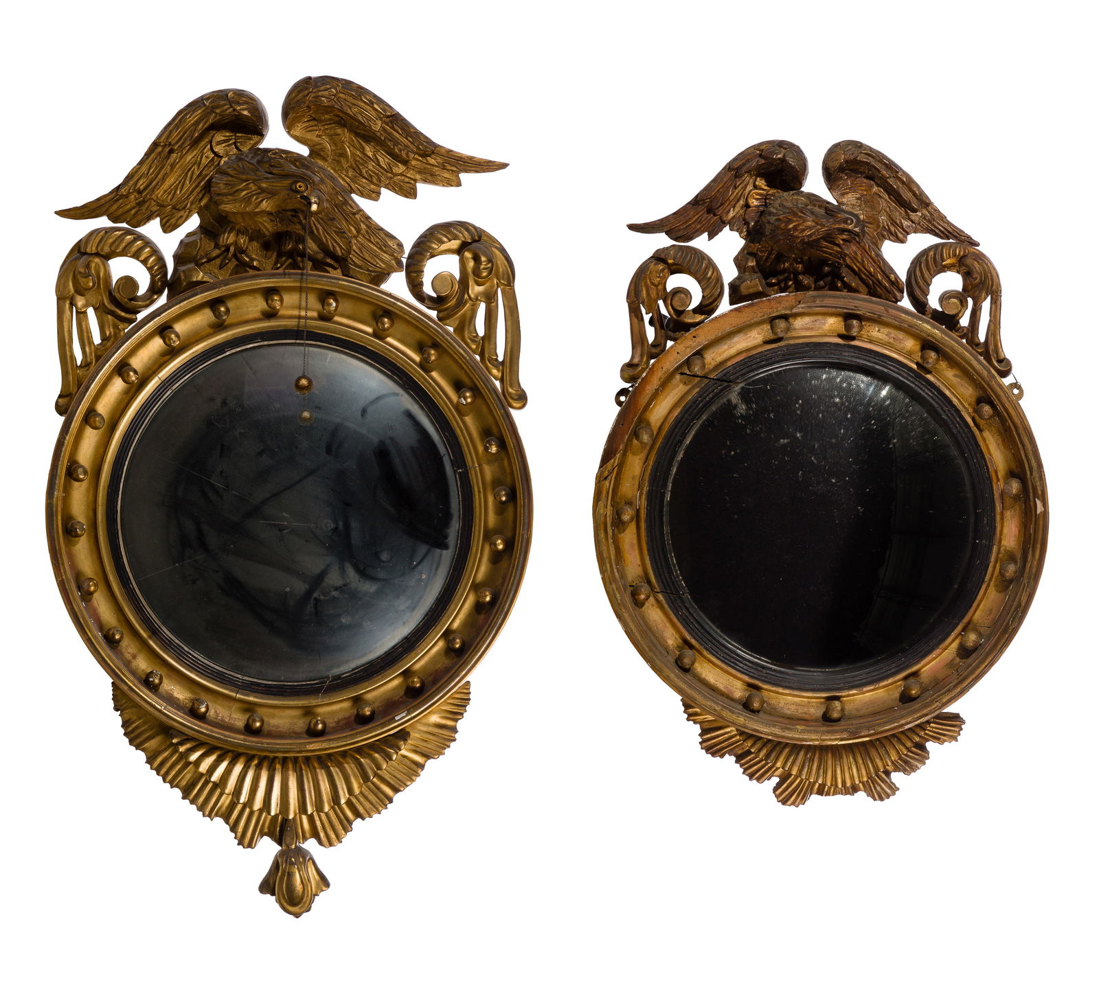 Federal Period Convex Mirrors: Federal Period Convex Mirrors (2) similar items, both having hand carved gilt wood eagles perched on rocks, circular frames with spheres, center having a bulls eye convex mirror, larger having a spher