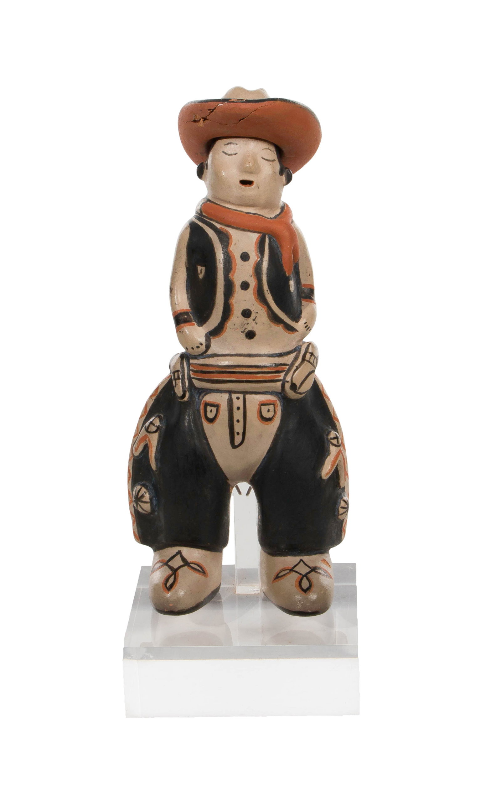 Pueblo Cochiti Style Figurine: Pueblo Cochiti Style Figurine An undated, unsigned, hand painted figure depicting a cowboy on an acrylic stand Property from: an Estate, Cook County, Illinois Height: 11 1/2 inches, Width: 4 1/4 inche