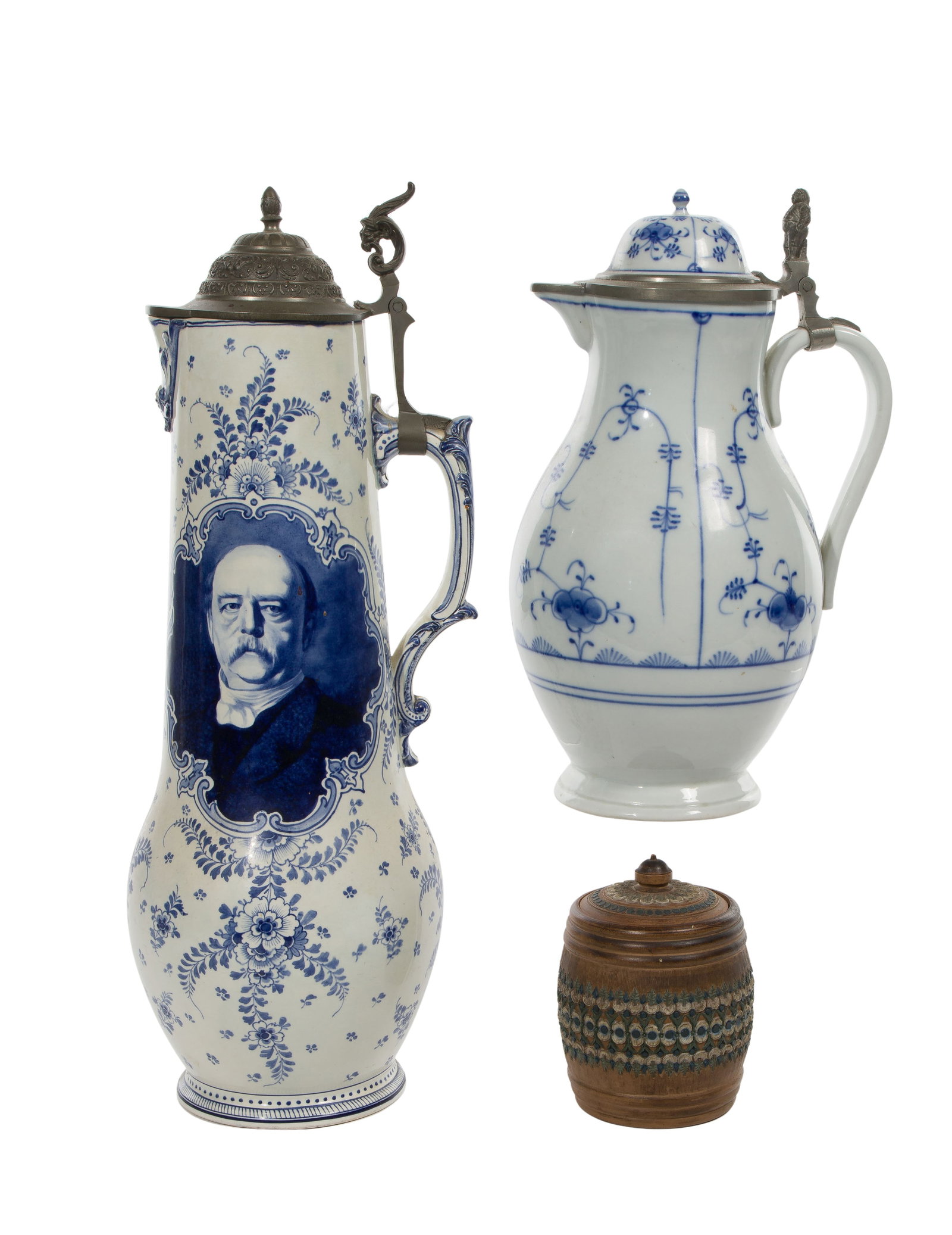 Meissen Style Blue and White Pitcher: Meissen Style Blue and White Pitcher (3) total items including a Meissen style pitcher with a floral motif and spurious mark to the underside; together a Royal Bonn #1299 lidded pitcher and a Doulton 