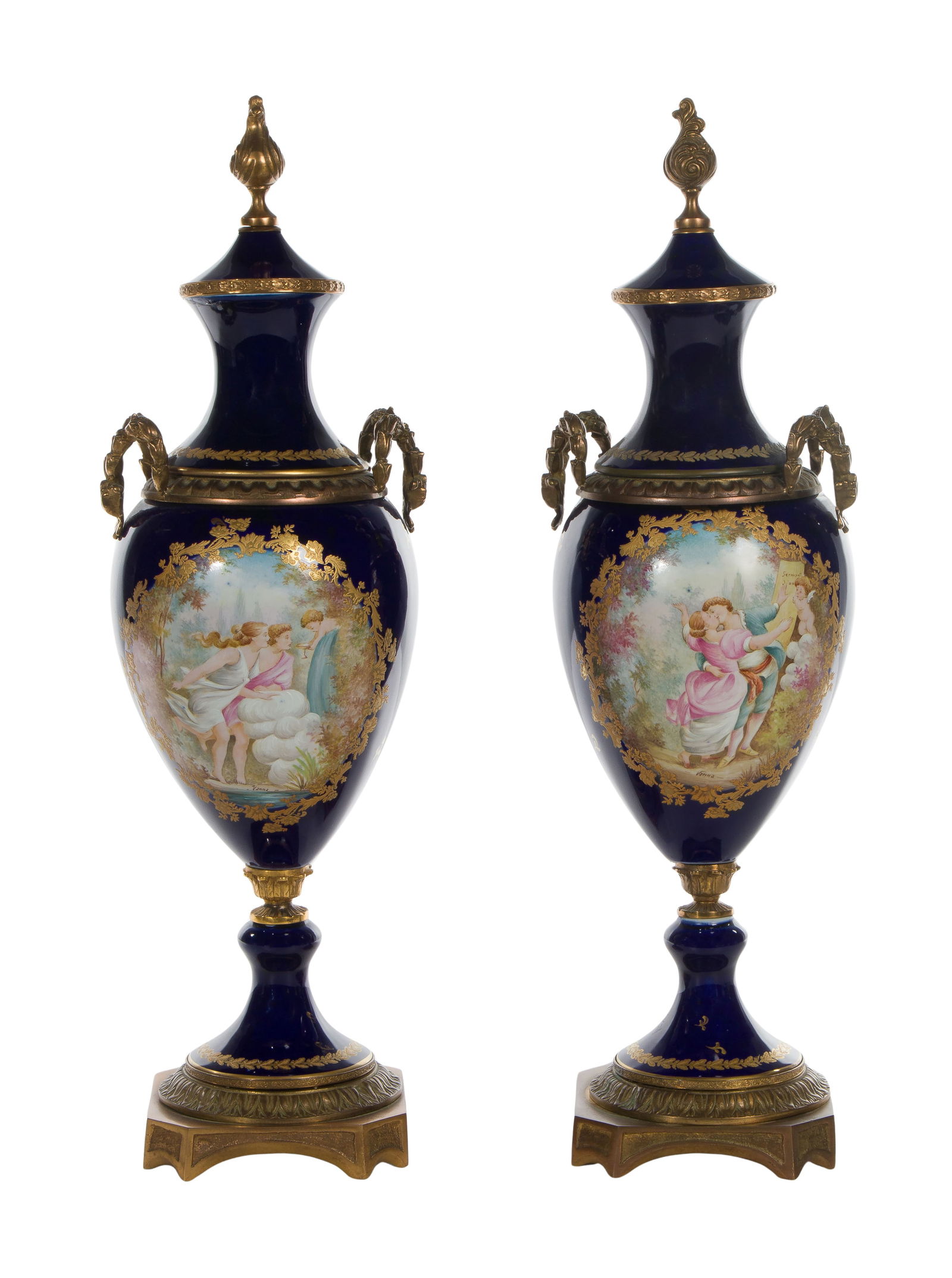 Sevres Style Porcelain Urns: Sevres Style Porcelain Urns A pair of cobalt lidded urns, having gilt, oval portraits, gilt embellished tops, brass handles and finials, stepped pedestal base, wreathed foot, spurious Sevres marking o
