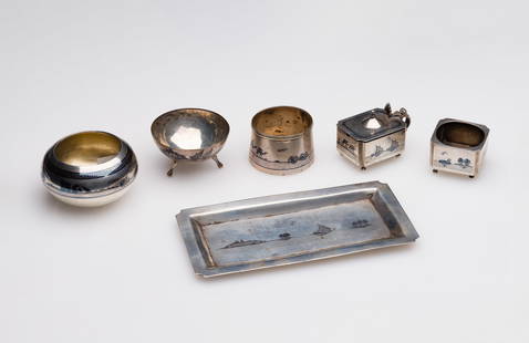 Iraqi Silver Salt Cellar and Condiment Set: Iraqi Silver Salt Cellar and Condiment Set (6) items of various shapes, sizes and purposes, having niello inlays of various forms including trees, camels, boats and buildings (unmarked) Property from: