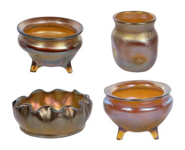 Louis Comfort Tiffany Favrile Glass Salt Cellar Assortment: Louis Comfort Tiffany Favrile Glass Salt Cellar Assortment (4) items including (2) footed round, a scalloped edge and a dimpled cylinder, all signed on underside Property from: The Estate of Sondra Be