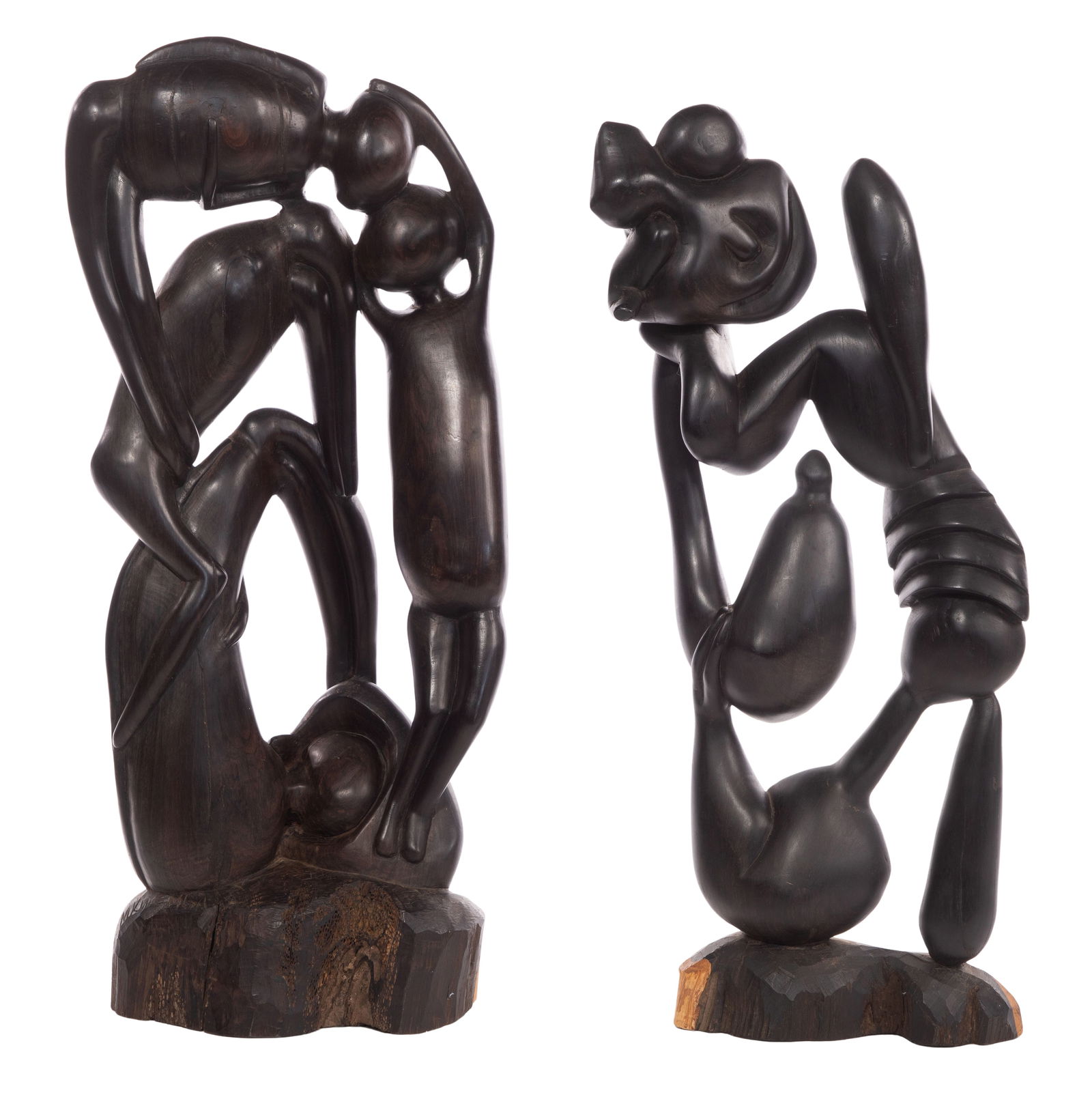 Makonde Ebony Sculptures: Makonde Ebony Sculptures (2) similar items of reticulated figures supporting those above them, having carved signature Property from: a Private Collector, Deerfield, Illinois Height: 25 inches, Width: